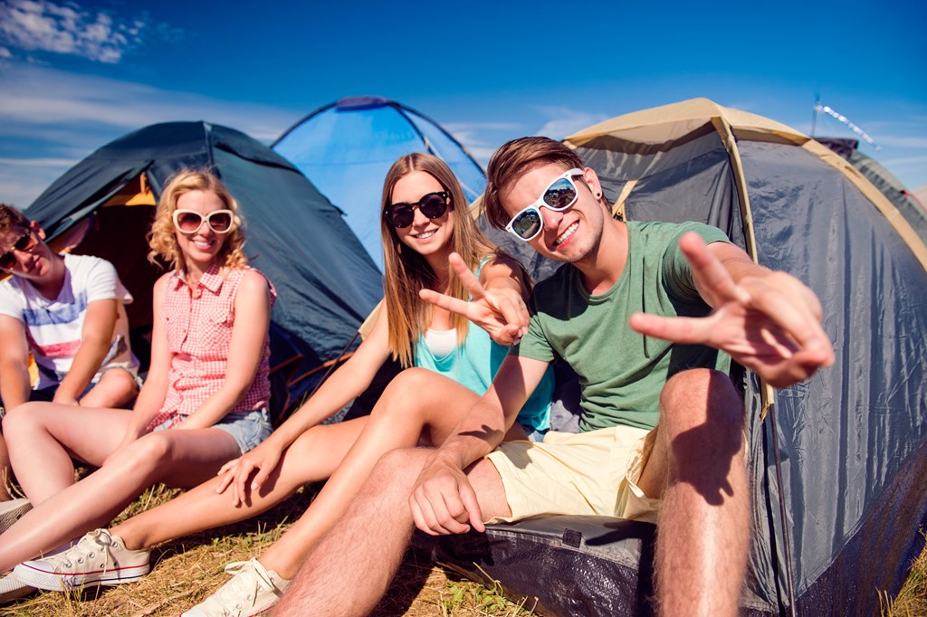 Group of friends camping in sunglasses.