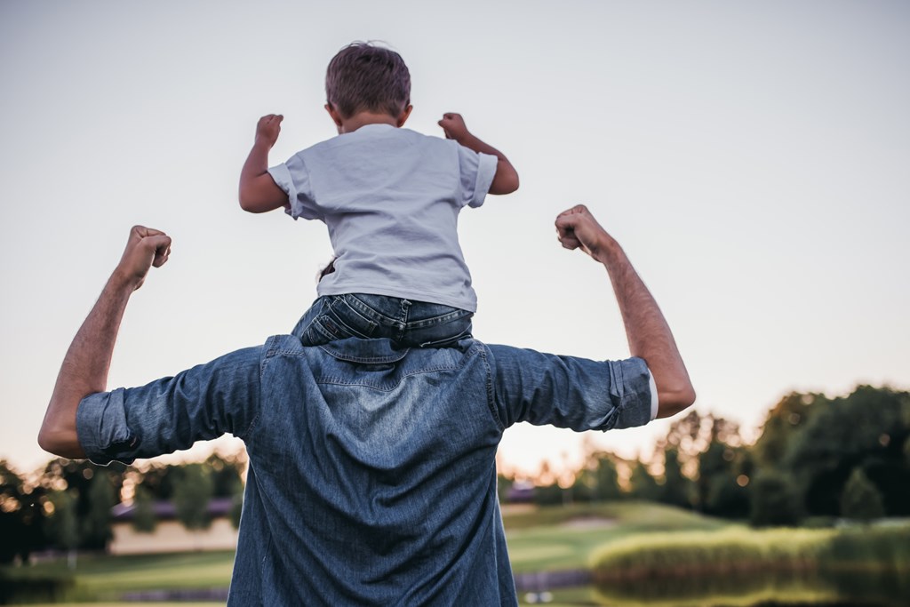 Dad and son having fun outdoors.