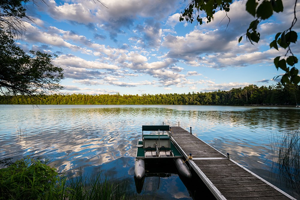 Pedal boat on a pier in Door County, Wisconsin with beautiful cloudy sky