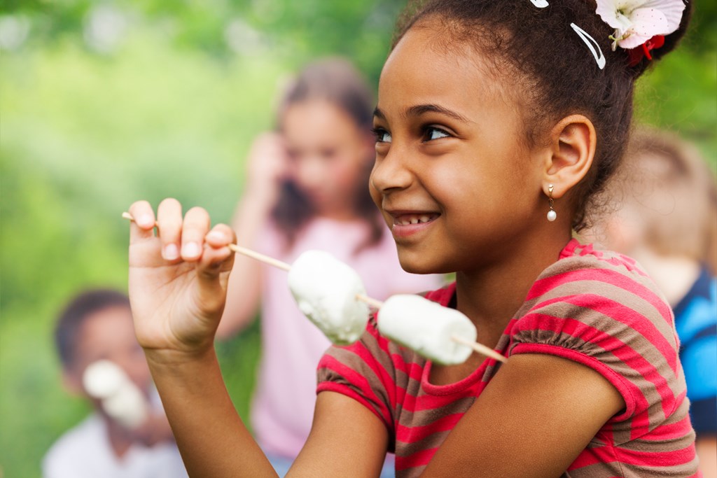 Girl toasting marshmallows.