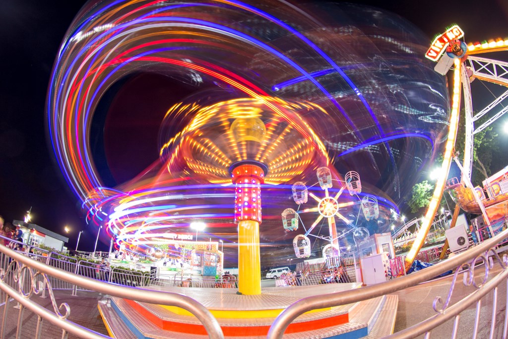 State fair carnival rides at nights using long exposure.