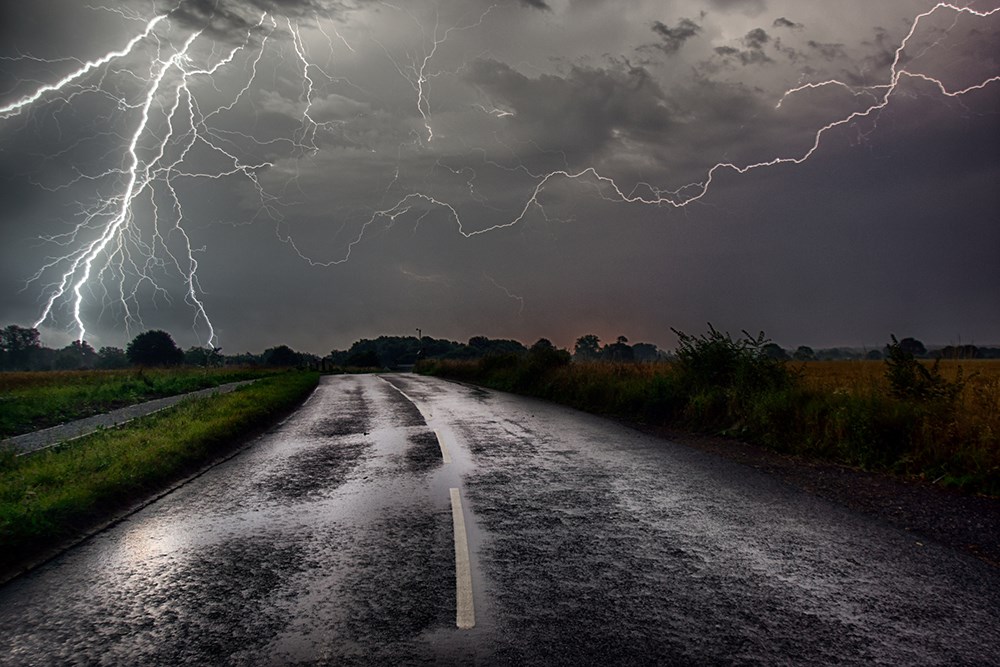 Bolts of lightning caught at the end of the road.