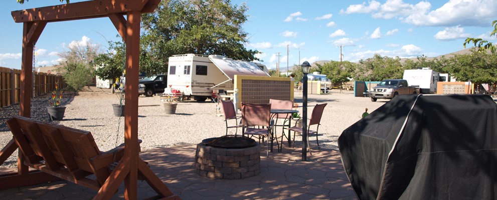 50/30amp back in, electric, water and sewer patio site.  Has gas BBQ grill and firepit.