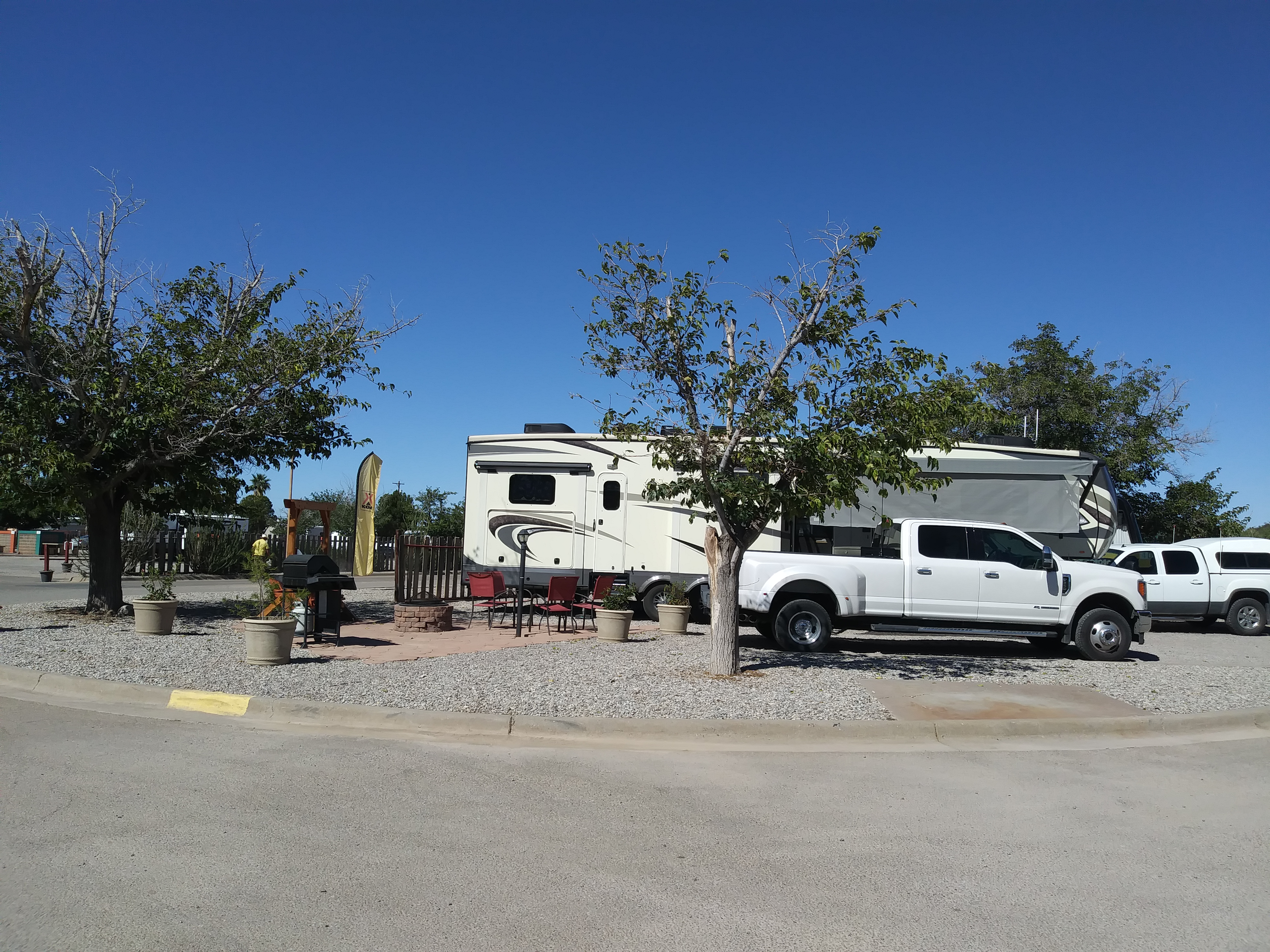 50/30amp back in, electric, water and sewer patio site.  Has gas BBQ grill and firepit.
