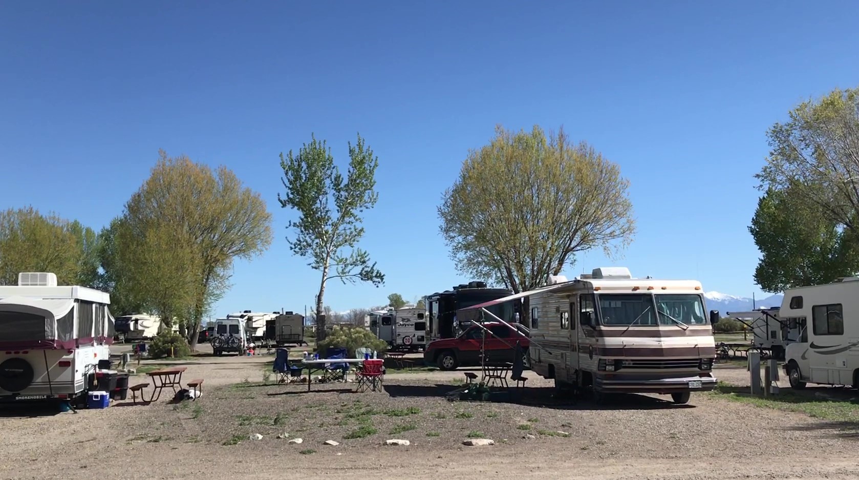 RVs face each other with common area for hanging out.