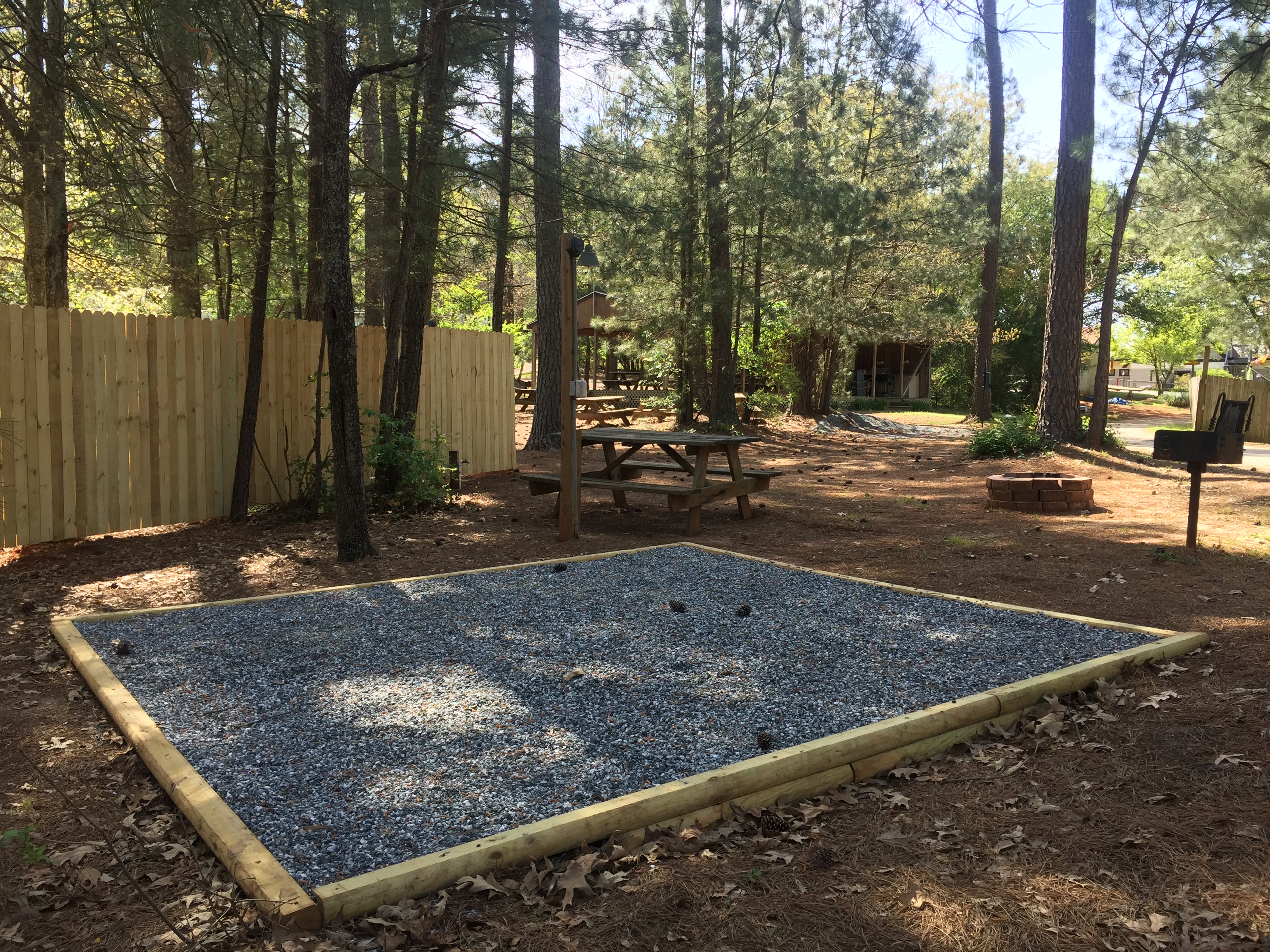 Premium Tent Site with 12x12 Tent Pad, Switchable On/Off light, Receptacle, Water and Picnic Table with Umbrella