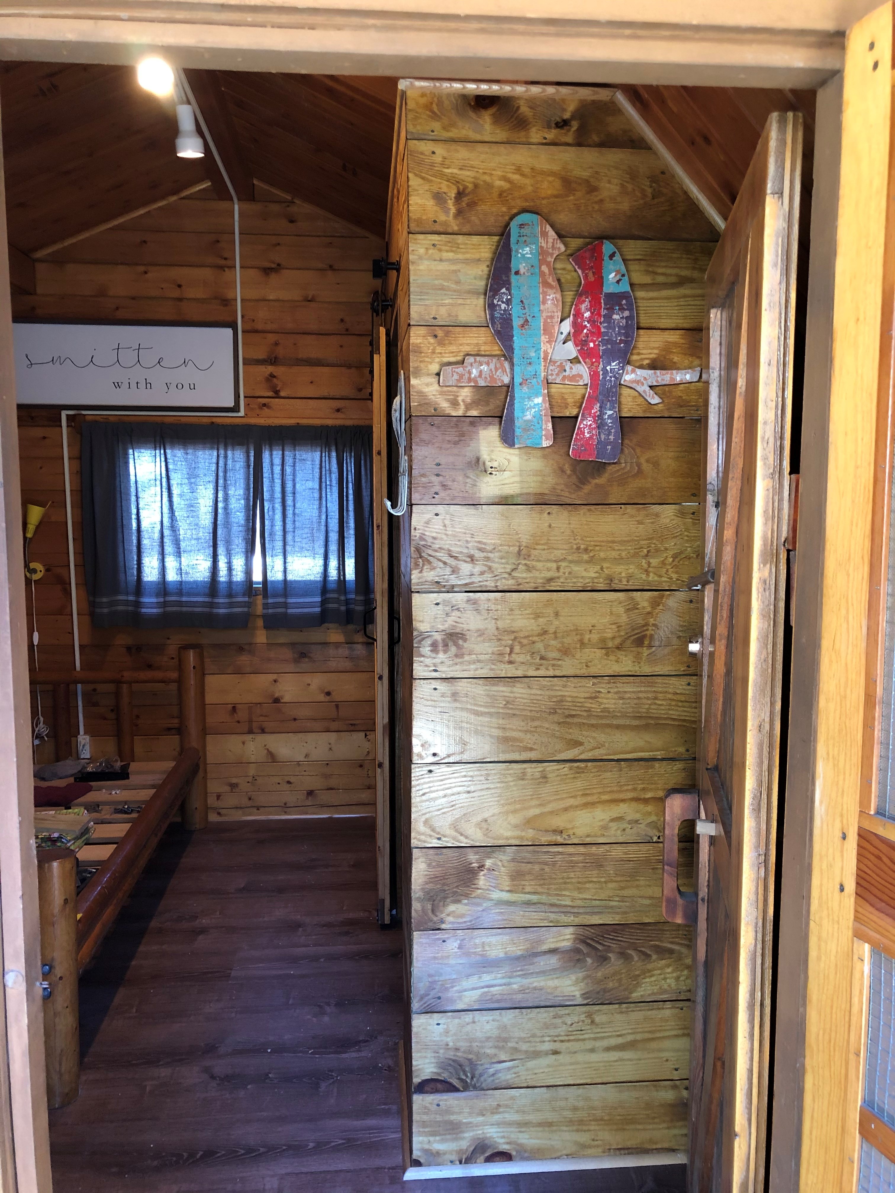 Looking into the one room Cuddle  Cabin from the front porch.