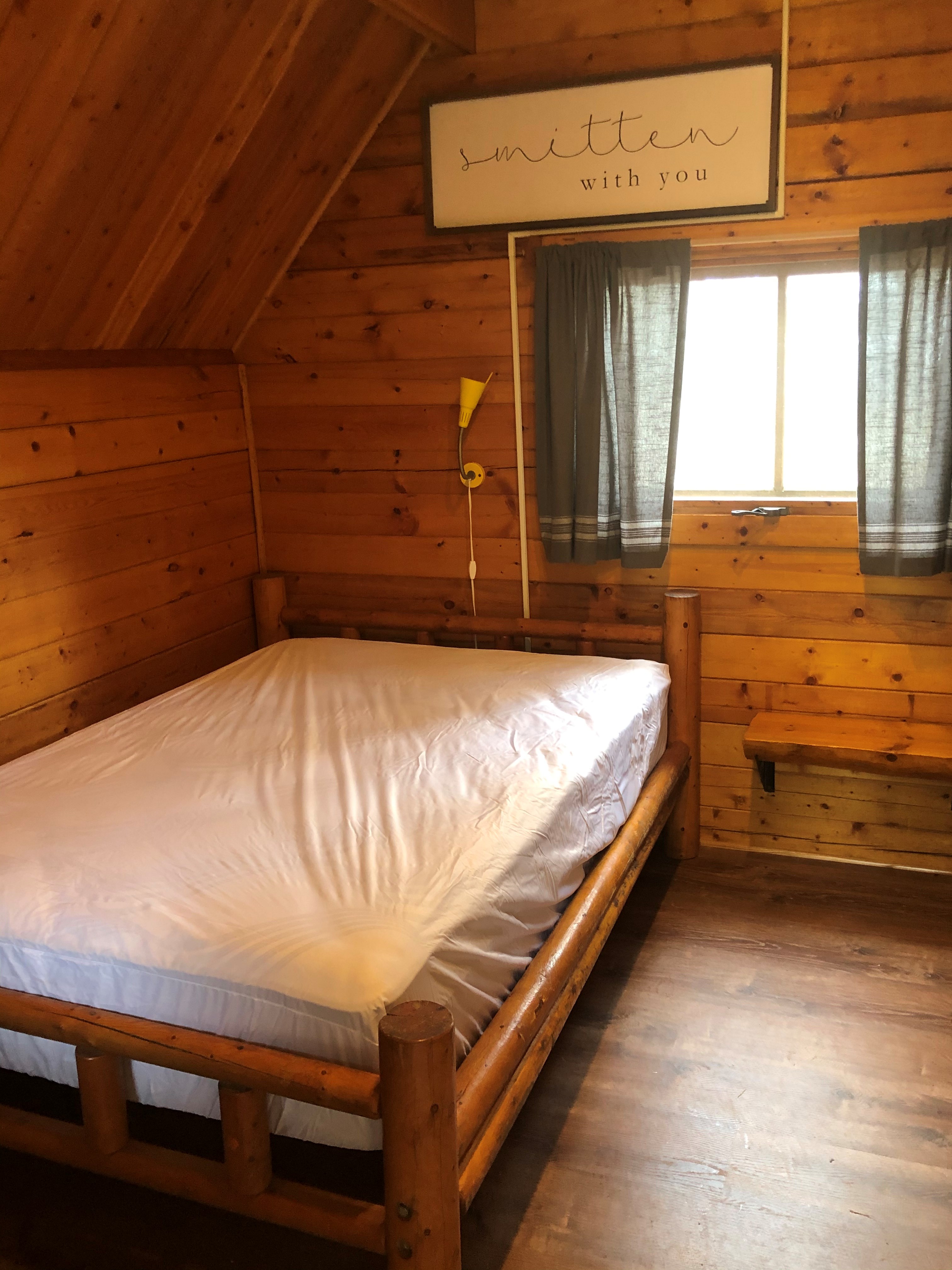 One room Cuddle Cabin full-size bed. Bring your linens, towels, and other personal items.