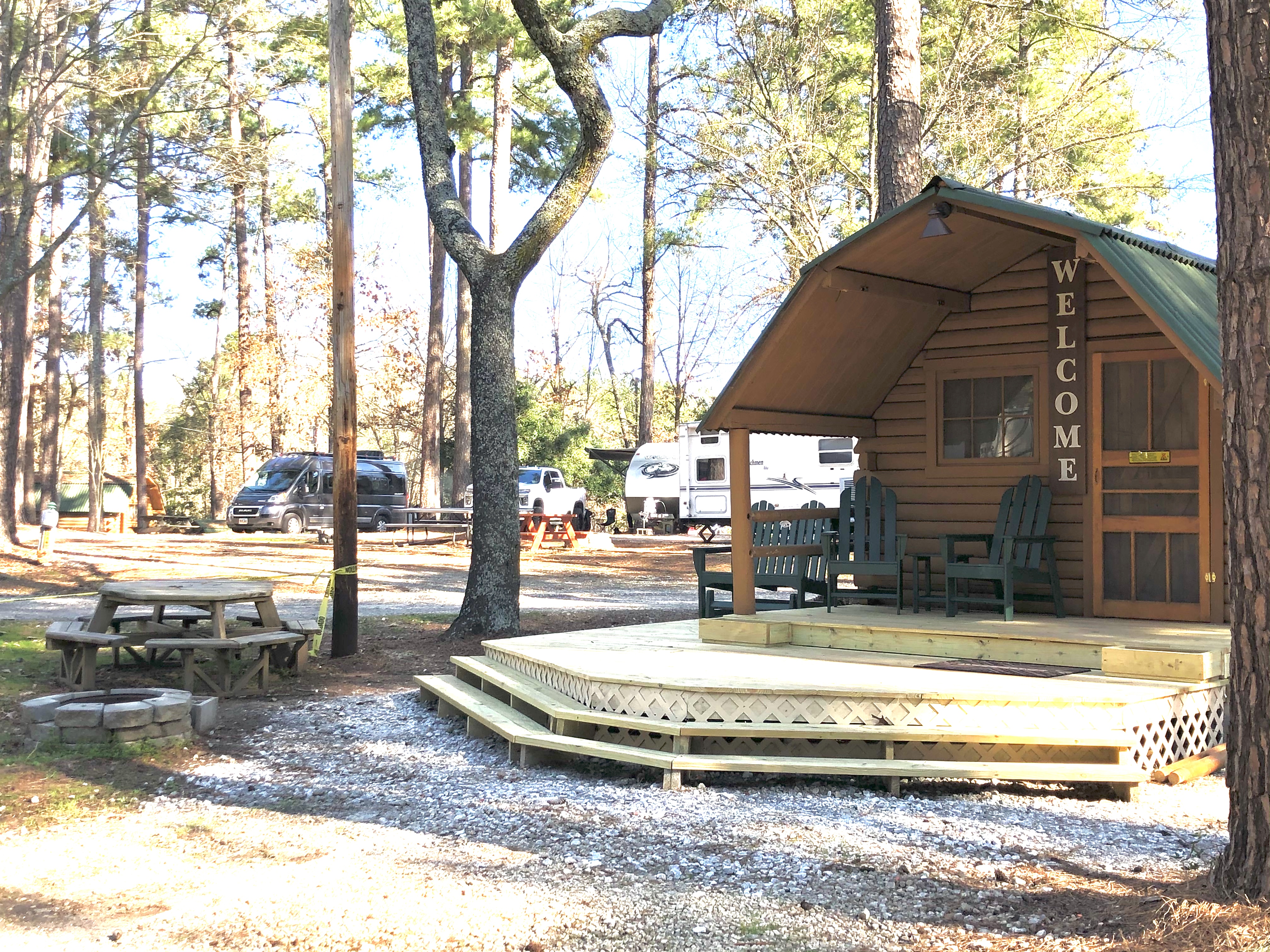 One-room Cuddle Cabin has just a full size bed but does have a toilet and sink (no shower or tub). It also has cable TV, a mini-refrigerator, and a hair dryer and Keurig coffee maker (bring your favorite).