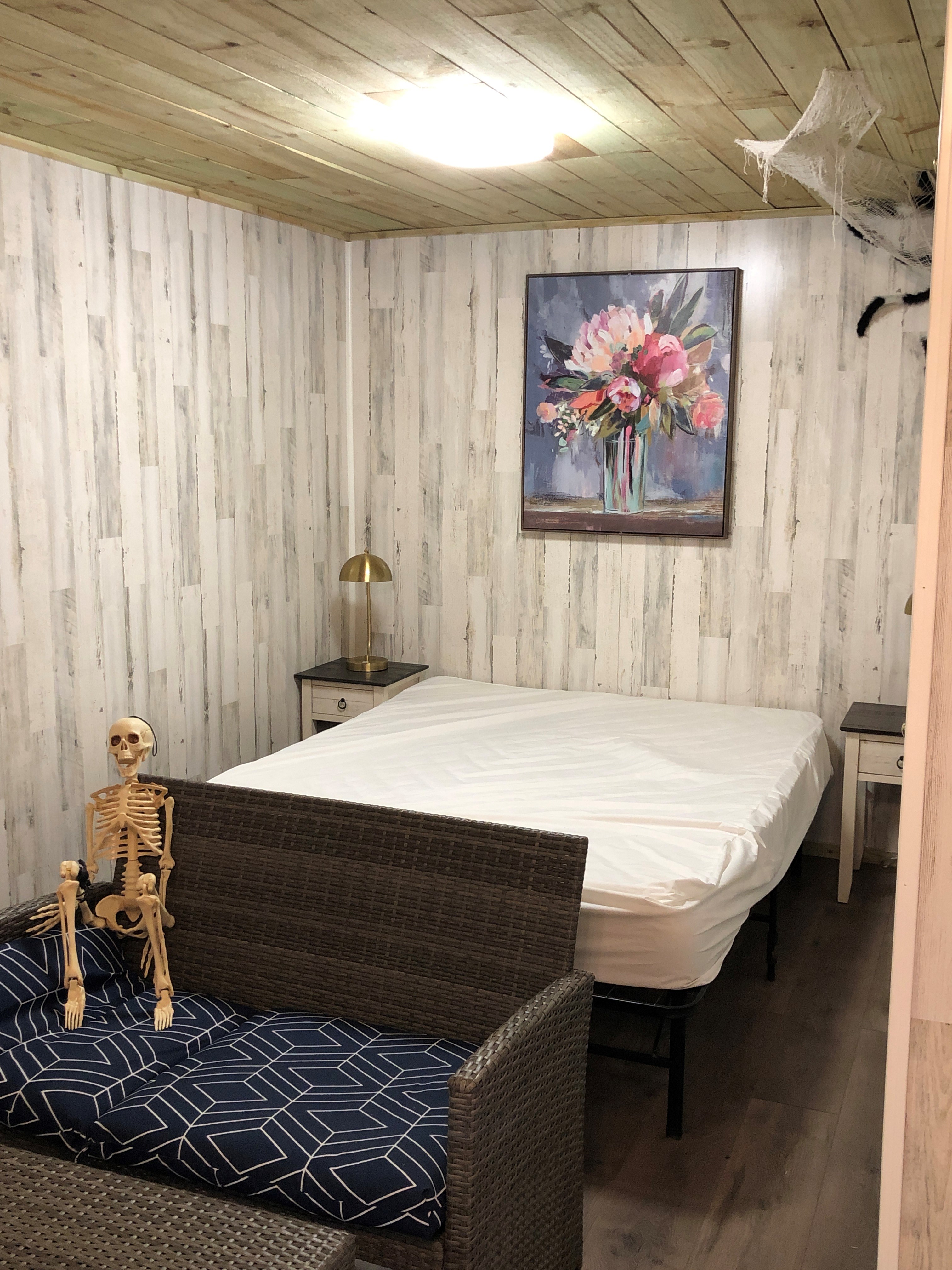 K9 Haunted Cabin queen size bed on main floor. Bring your own bed sheets, pillows, towels and personal items.