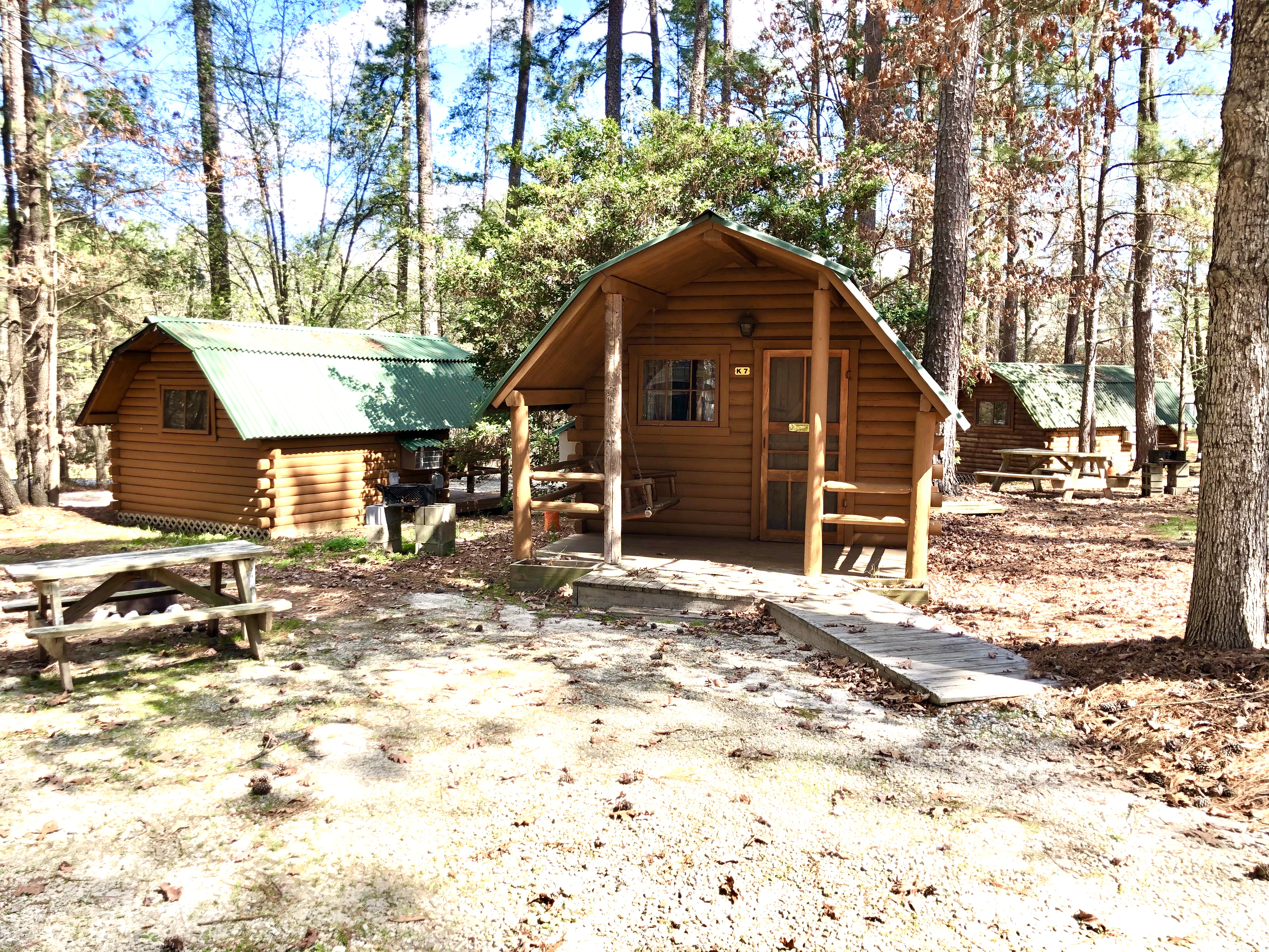 One room camping cabin (full size bed and one set of bunk beds) with mini-refrigerator and cable TV. Room for boat    parking nearby.