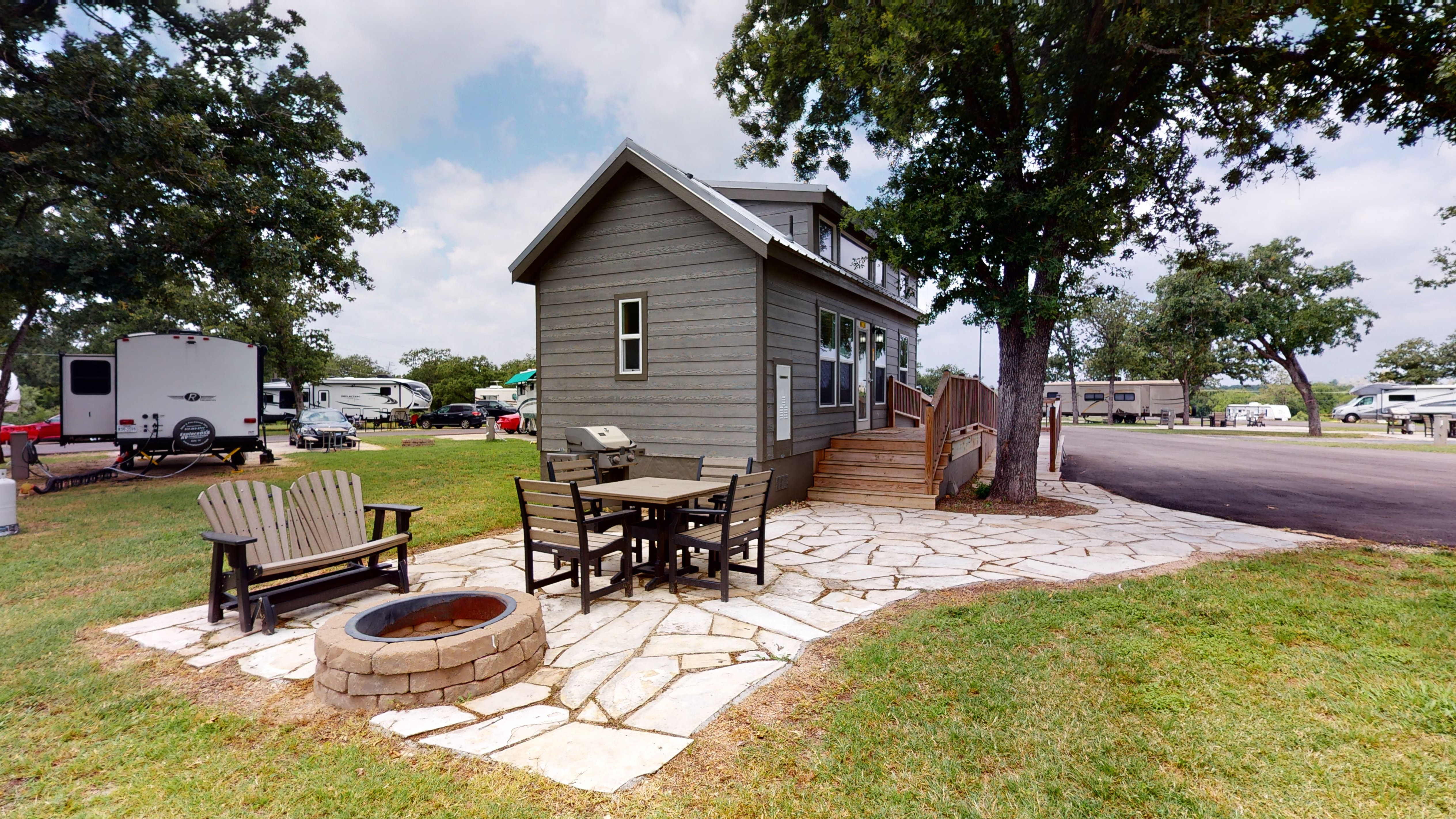 ADA Deluxe Cabin come complete with a fire pit and outdoor seating.