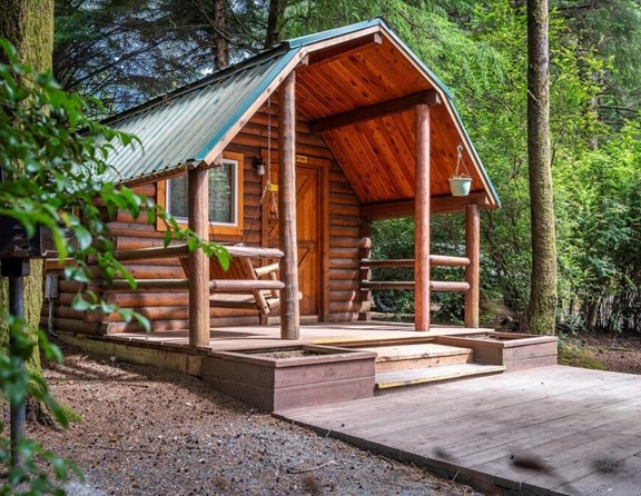 Experience the rugged beauty of the Pacific Northwest from the comfort of our rustic cabins. Perfect for families and road trippers exploring the southern Oregon Coast, these wooded camping cabins offer a scenic forest setting, outdoor picnic spaces, and a cozy atmosphere just minutes away from local beaches.