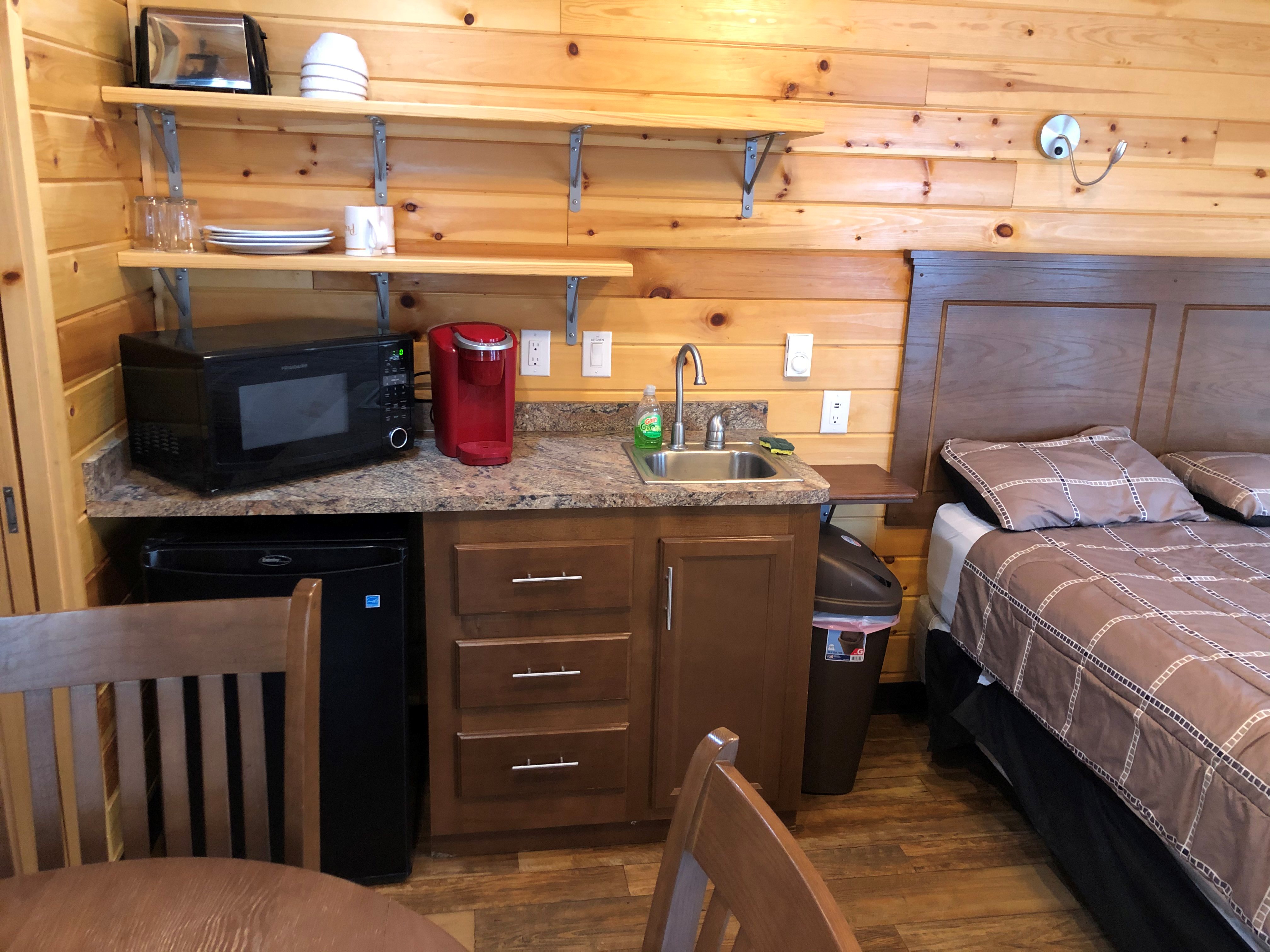 Half Kitchen, includes, small fridge, microwave, Keurig coffee maker, toaster and utensils.