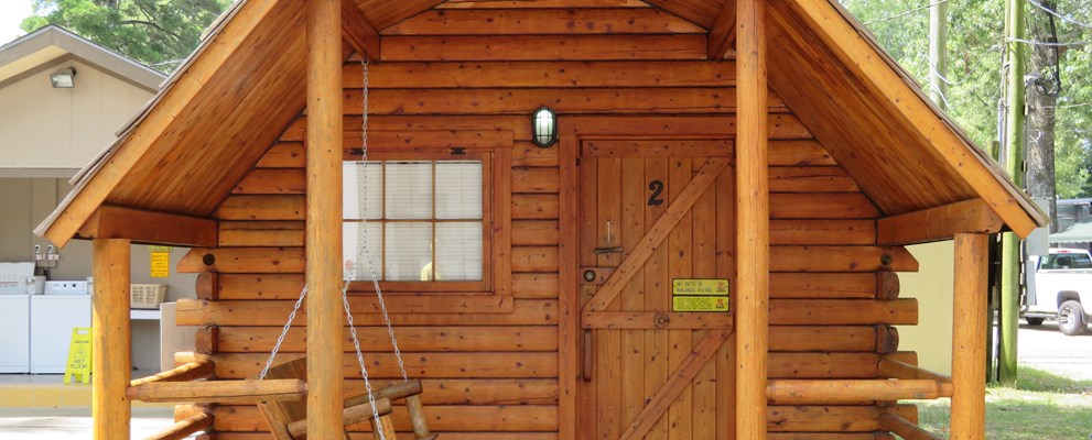 STAY IN ONE OF OUR 1 ROOM CAMPING CABINS.THIS CABIN SLEEPS 4 WITH IT'S BUNK BEDS AND FULL SIZE BED.