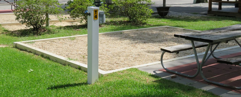 THIS IS AN EXAMPLE OF ONE OF OUR TENT SITES THAT ARE CONVENIENTLY LOCATED IN THE MIDDLE OF OUR CAMPGROUND SO YOU ARE NEAR THE BATH HOUSE/LAUNDRY AND STILL CLOSE ENOUGH TO THE POOL AND STORE TO GRAB AN ICE CREAM OR A SODA. THESE SITES INCLUDE 20 AMP ELECTRICITY, WATER, WIRELESS INTERNET, PICNIC TABLE AND FIRE PIT. THE TENT AREA IS A LIGHT PEA GRAVEL  AND HAS A PATIO .