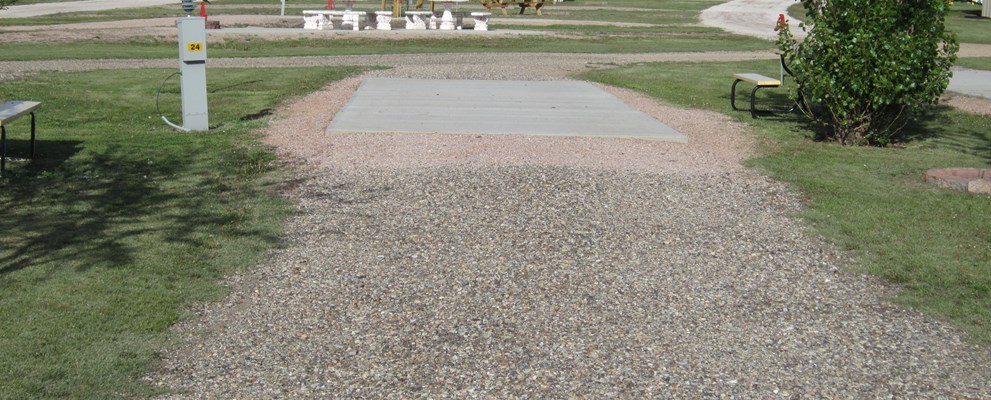 PULL THRU FULL HOOK UP SITE WITH CONCRETE PAD