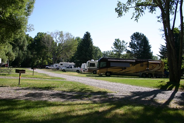 Full pull through 50 Amp water, electric and sewer RV site.