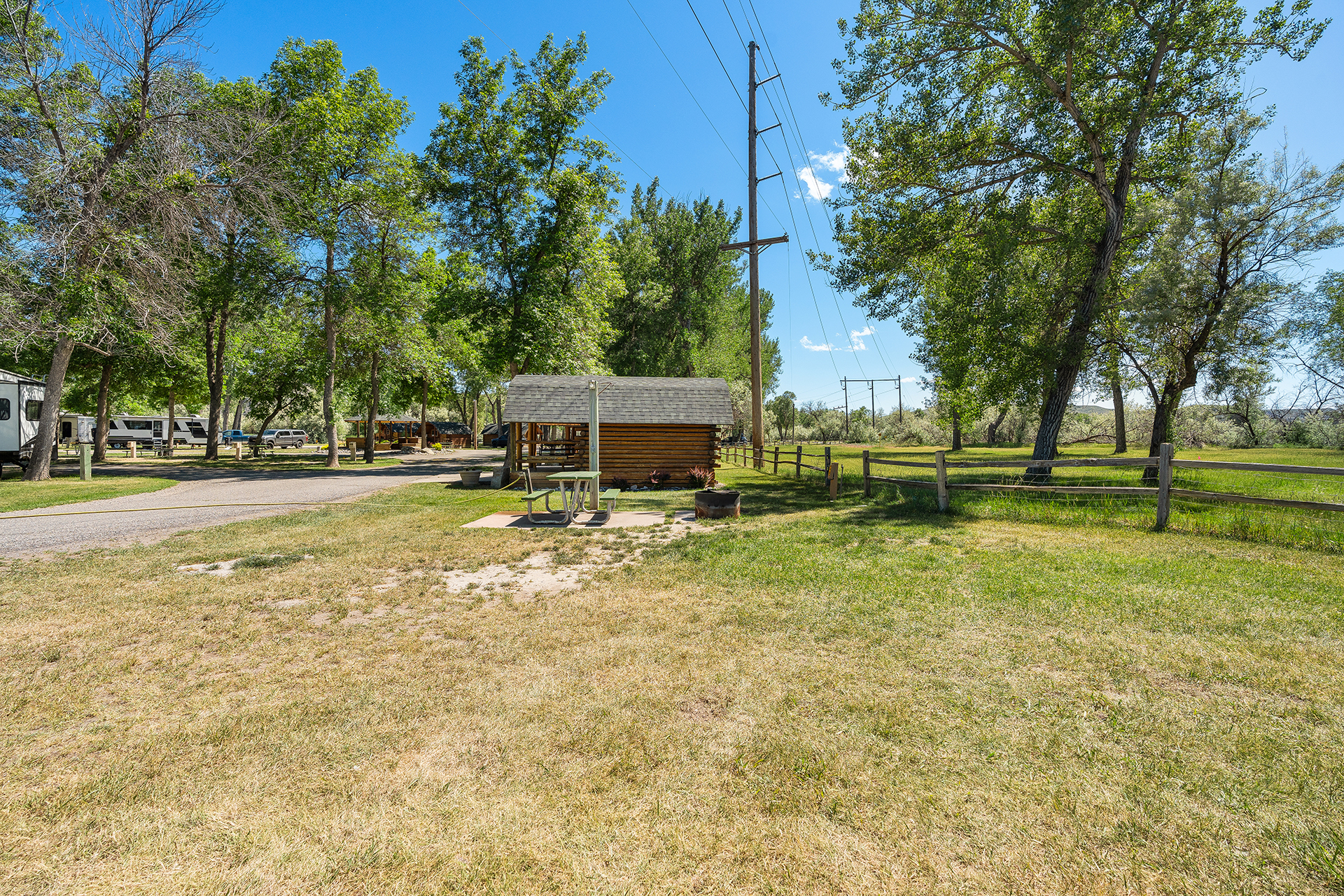T03, Tent Site - Water + Electric with Patio, Grass Pad