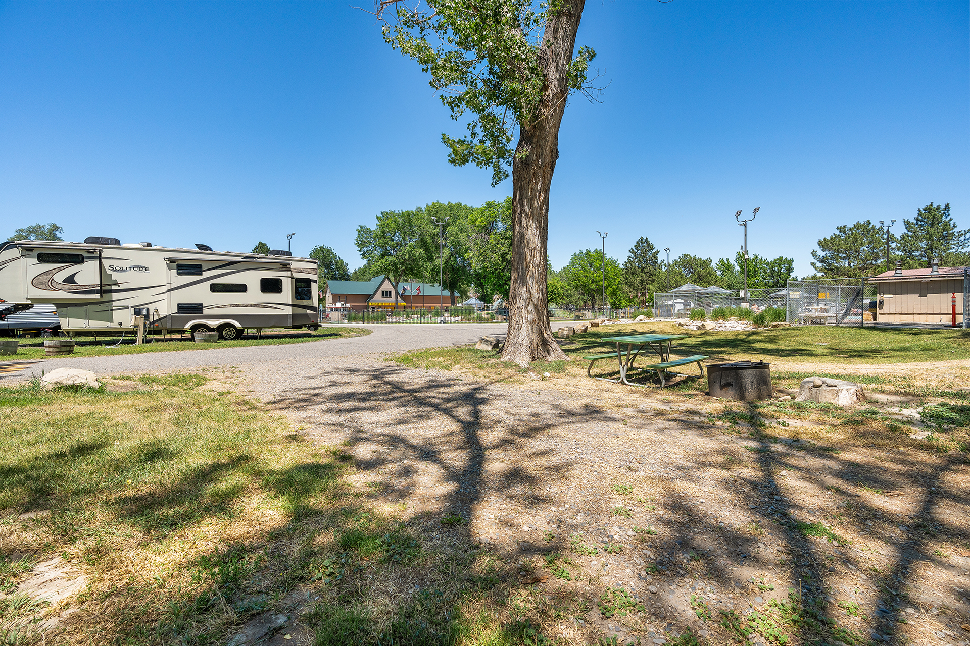 RV 145, Back-In 30/20 AMPS Water + Electric - Gravel