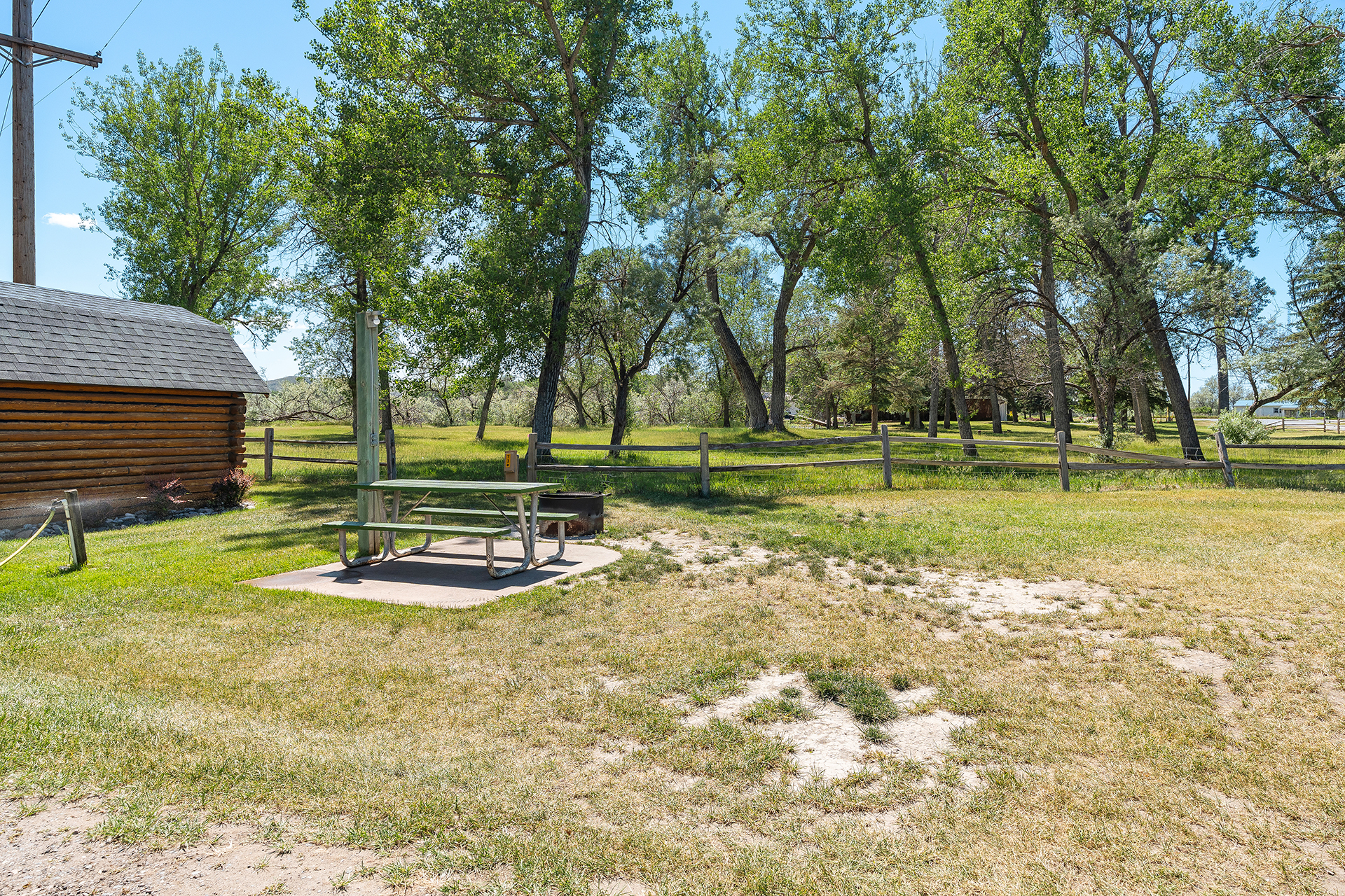 T03, Tent Site - Water + Electric with Patio, Grass Pad