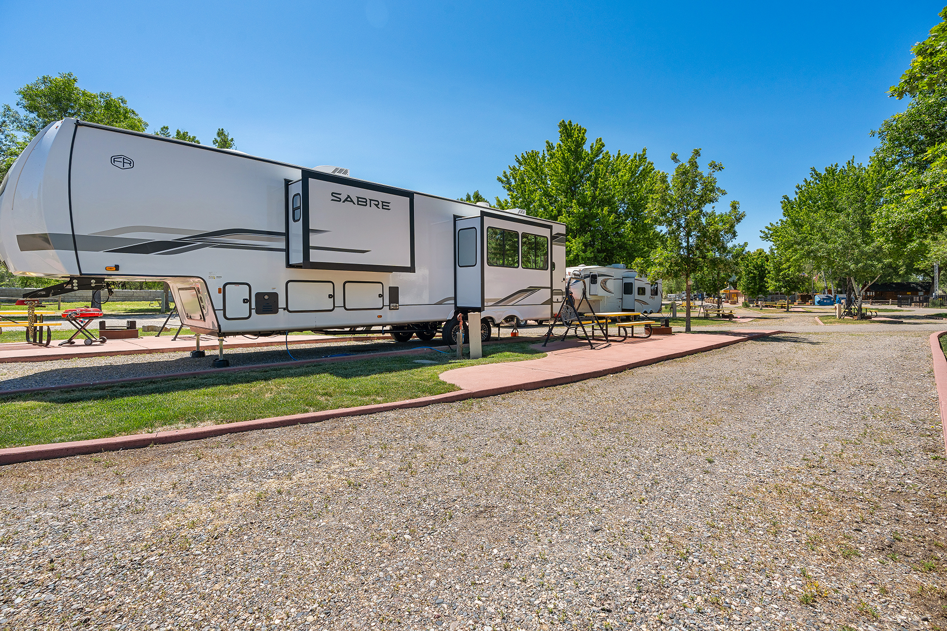 RV 39, Pull-Thru 50/30 AMPS Water + Electric KOA Patio®