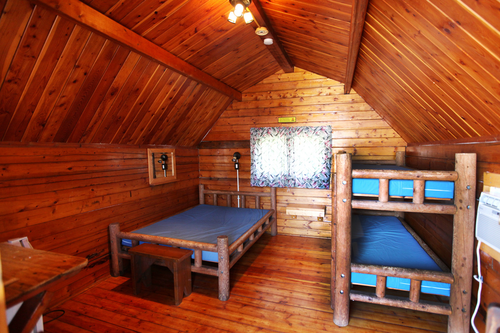Our upgraded 1 room Camping Cabins even have a television.