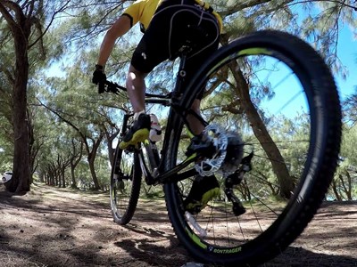 Closeup of a man's back tire while going on a bike ride at Viejas Grade Road.