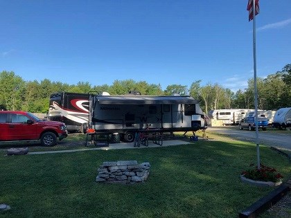 50/30 amp pull thru site. This site has a patio and sits on a corner lot. Nice fireplace.
