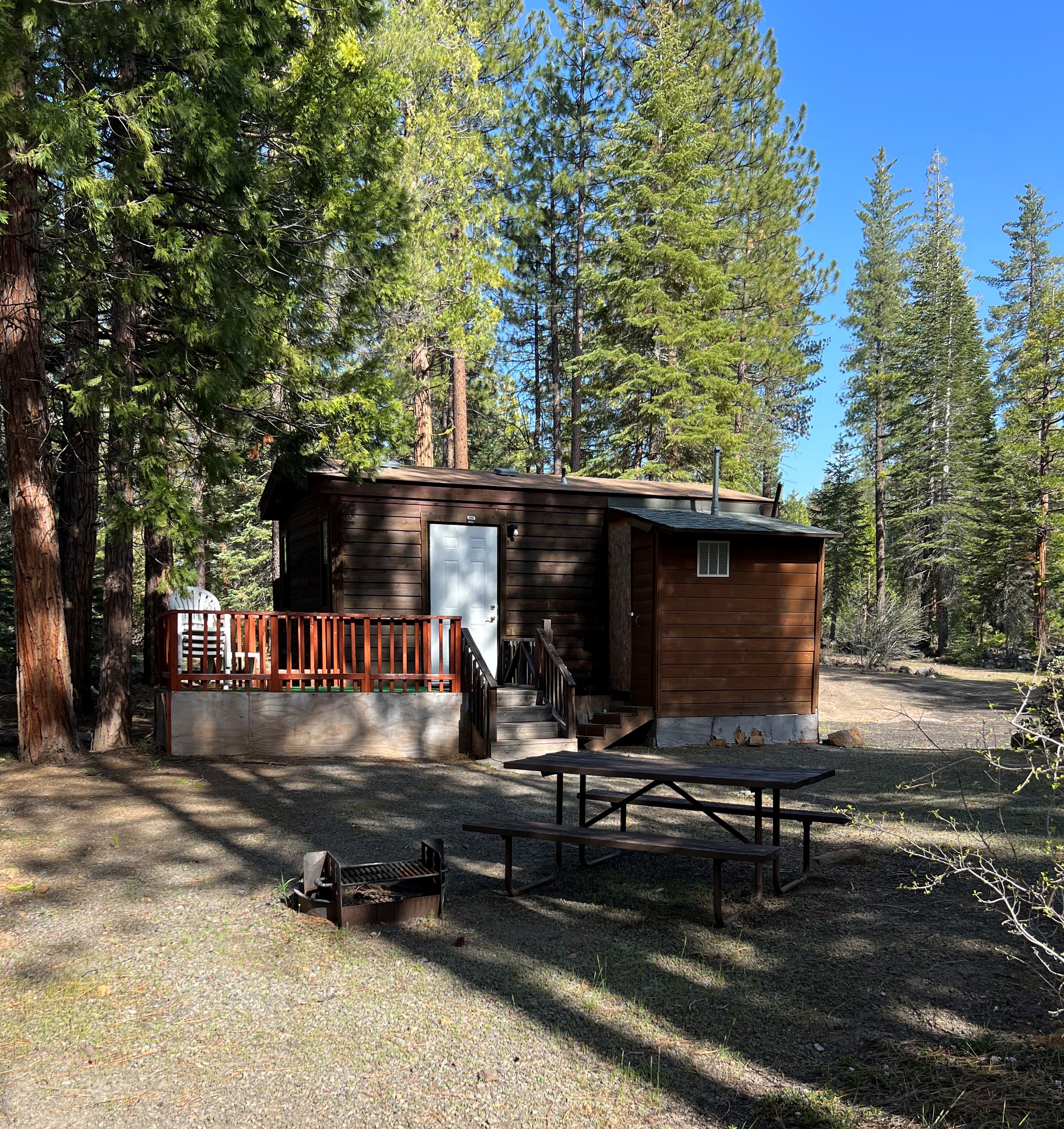 Stay at our cabin that has a queen bed and 2 sets of 3 bunk beds. Air conditioner, TV, microwave, and a private bathroom.  Call us to book your reservation at 530-335-7418.