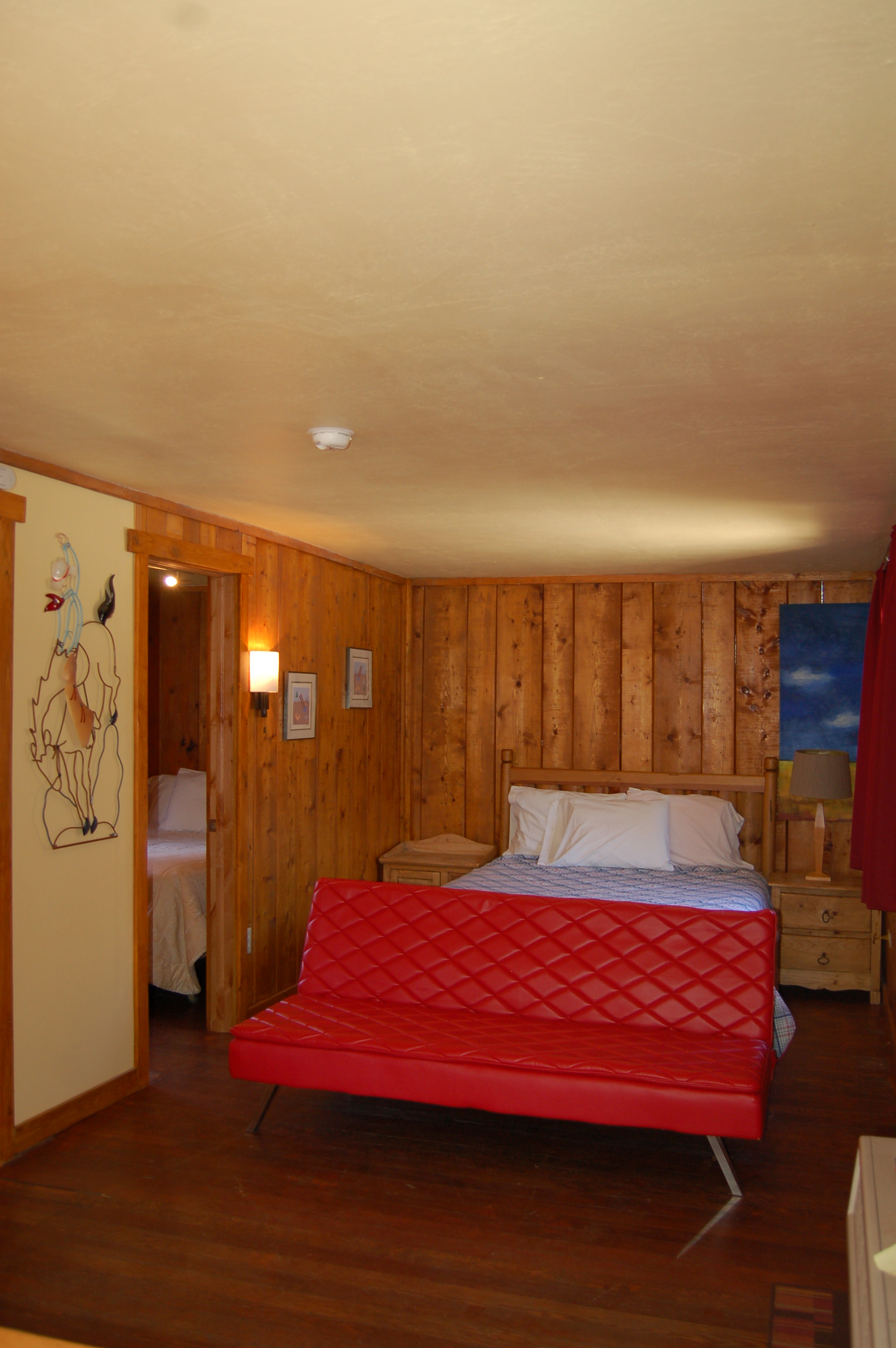 Main room with separate bedroom to left with double bed