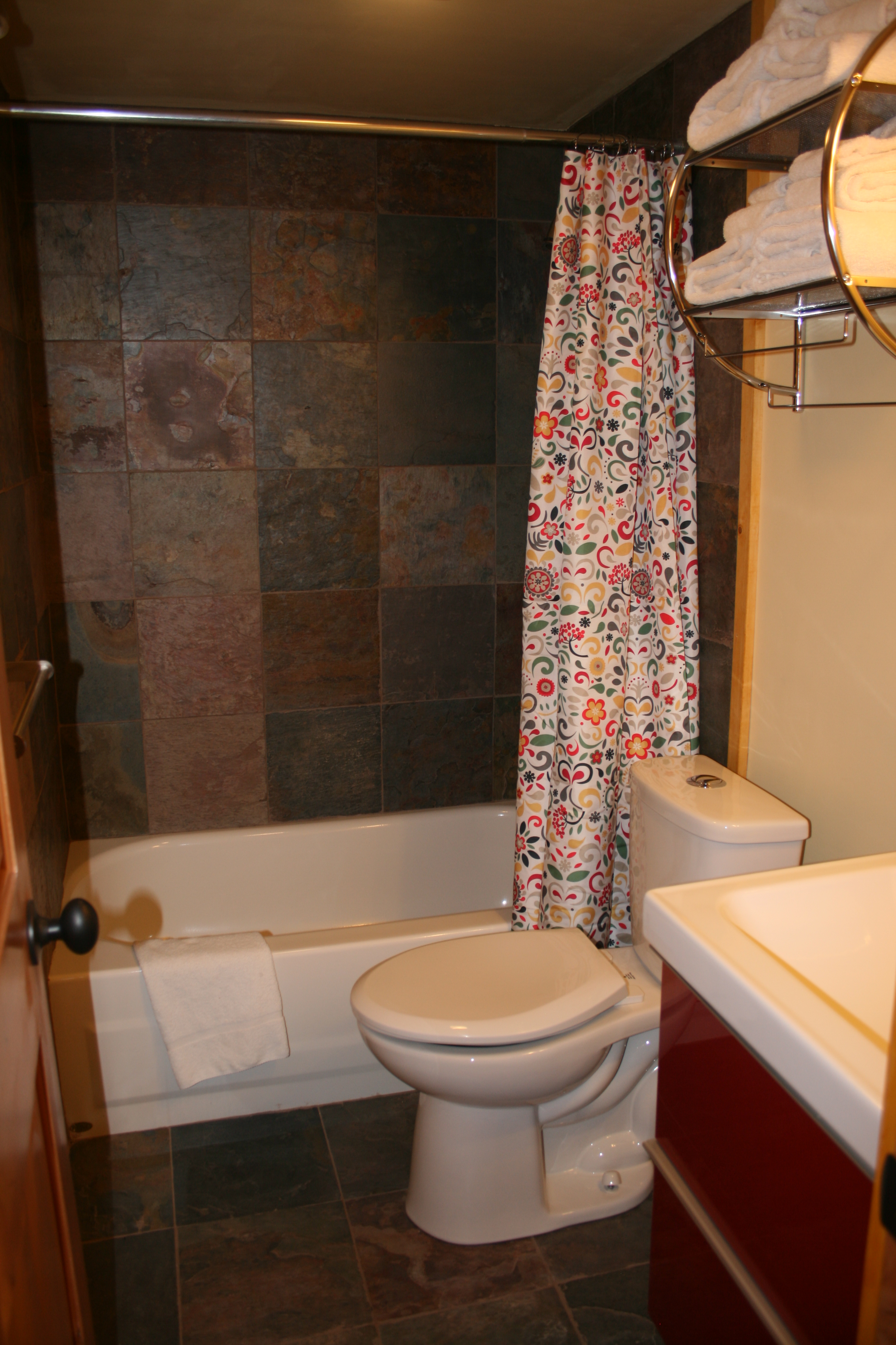 Fresh new bathroom with slate tile and extra vanity