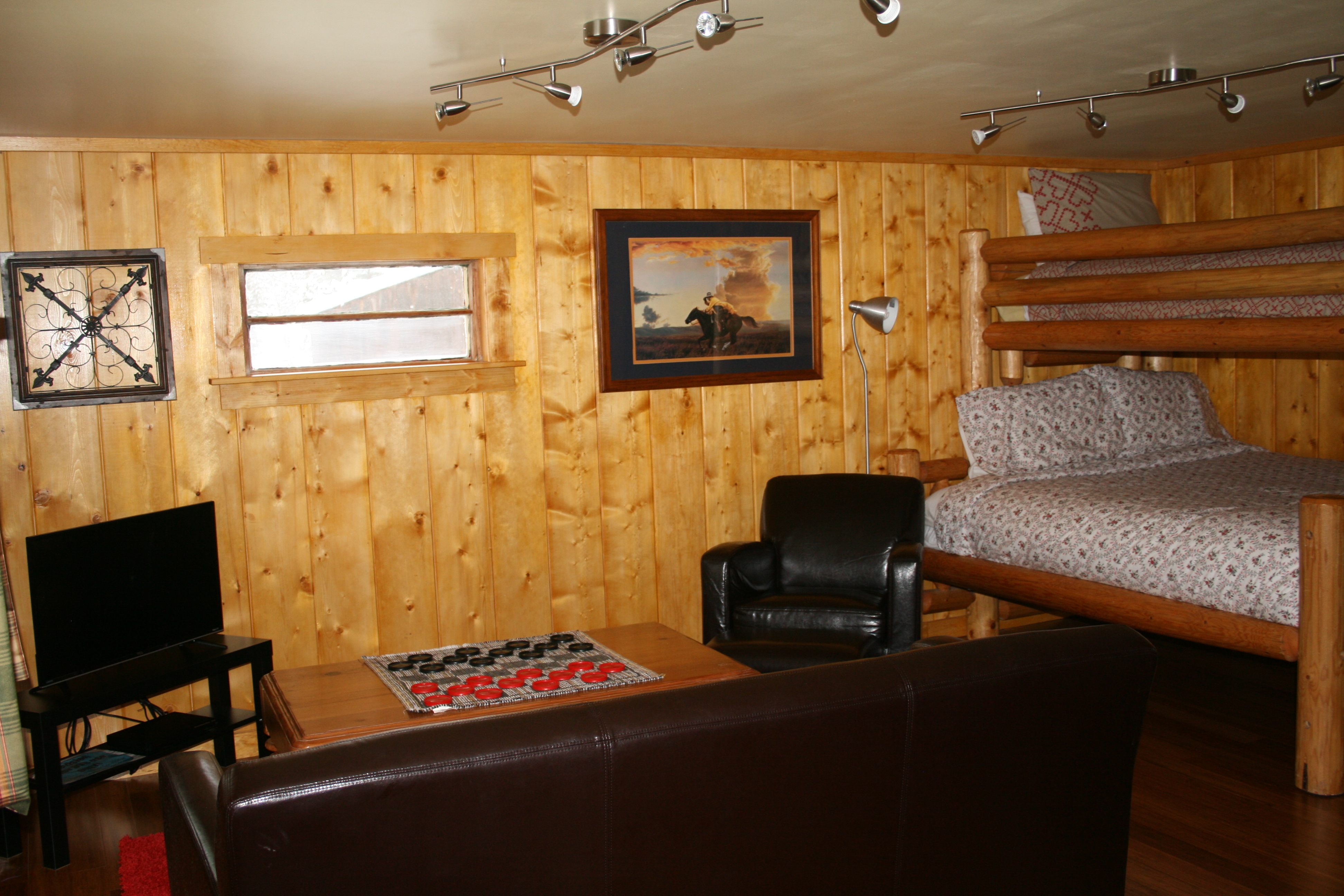 New furnishings in living room along with bunk beds