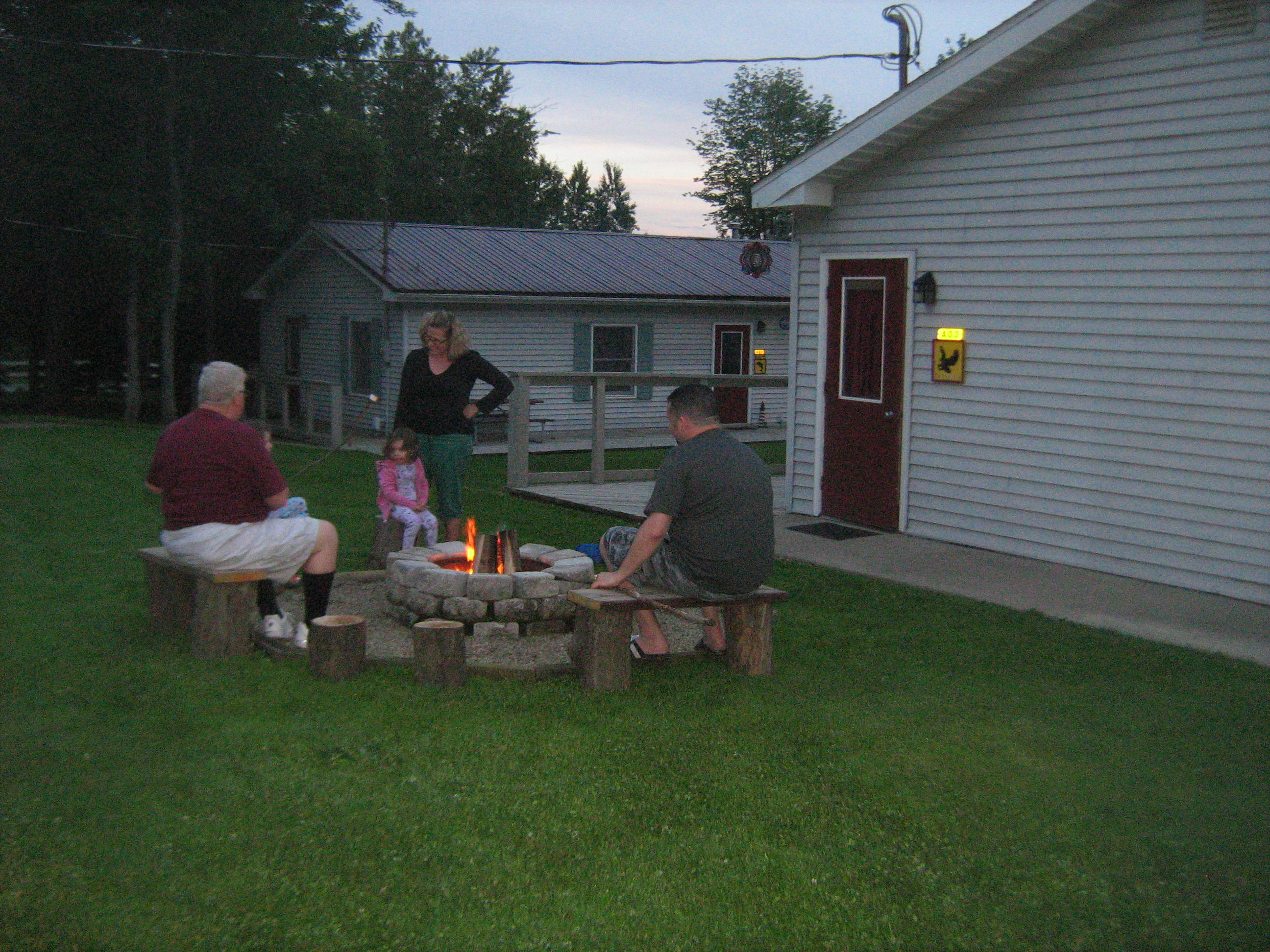 family enjoying a beautiful campfire