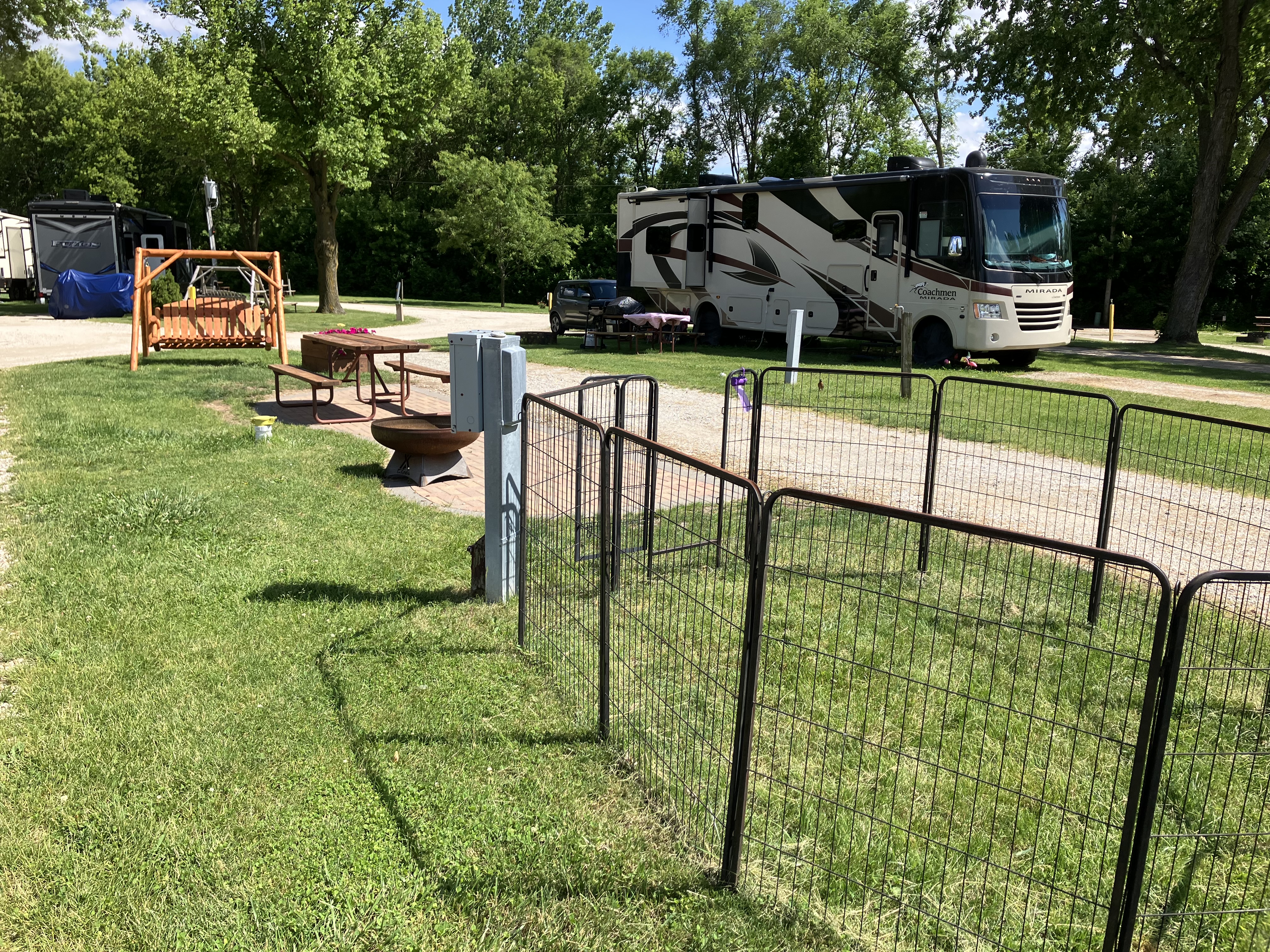 beautiful Patio Sites with Swing and a Puppy Fence