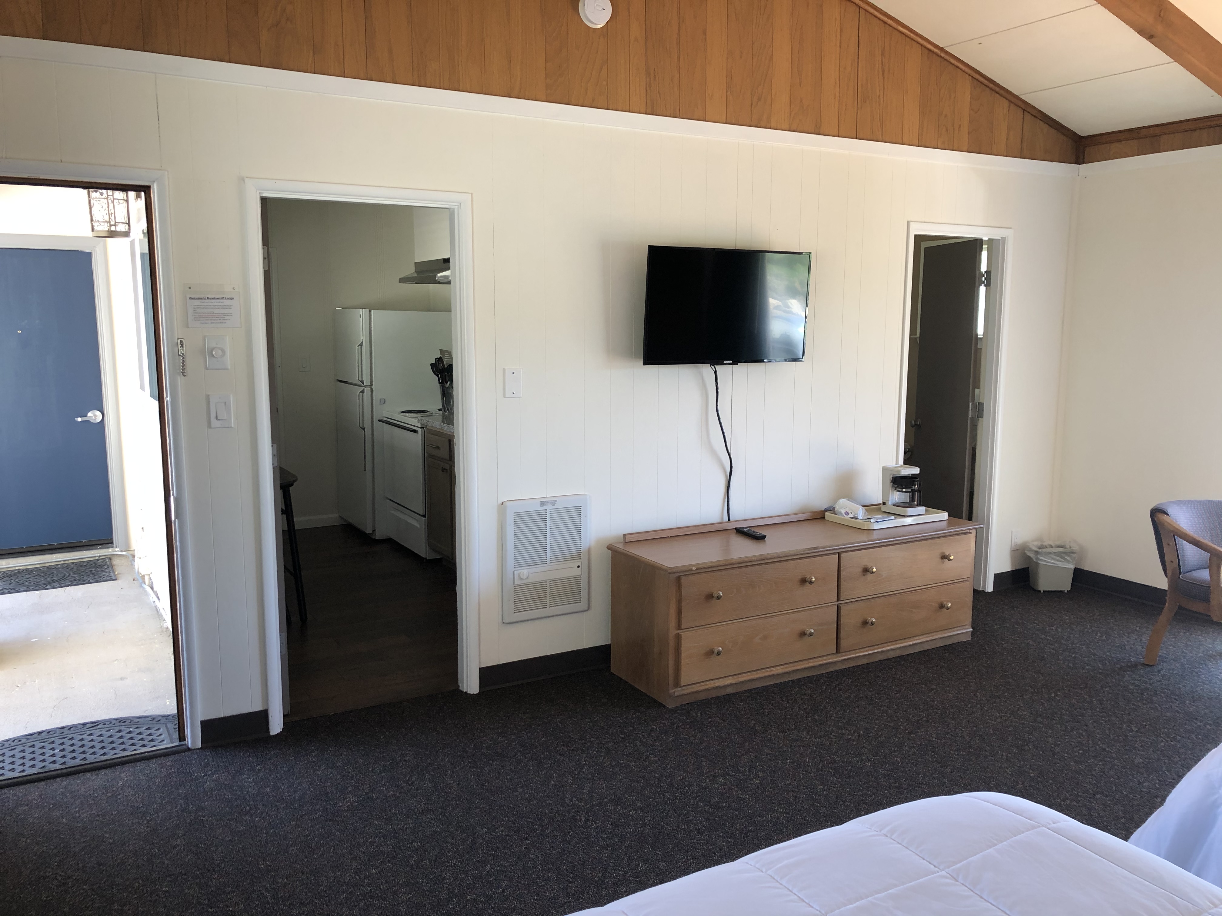 Room 103 TV wall and kitchen