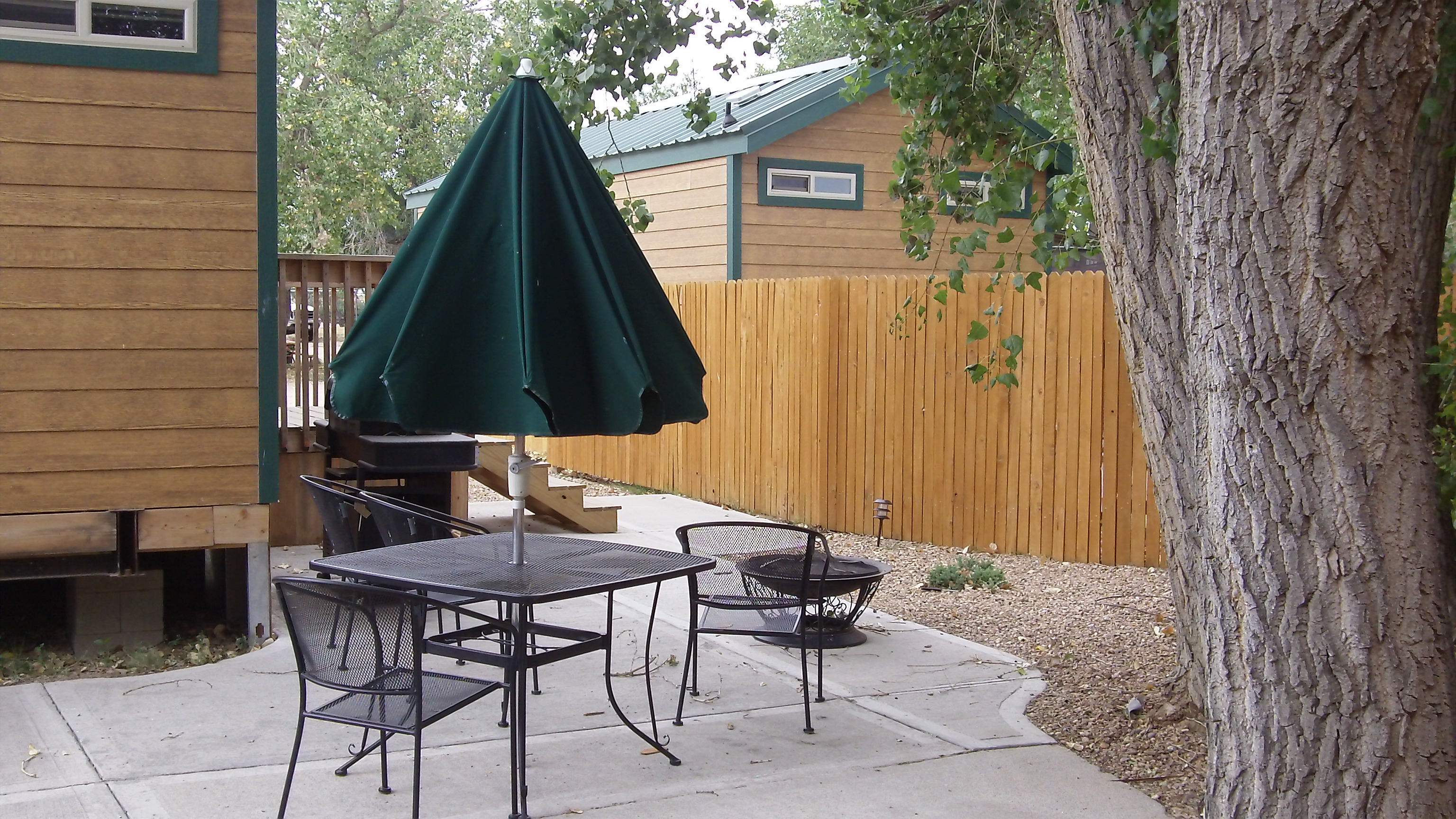 Our Deluxe Lodges have nice private patios with fire ring and gas BBQ Grill table and chairs for our guests