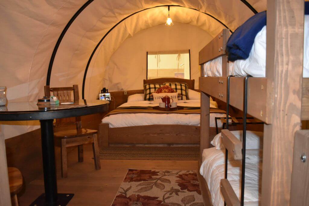 Wagons interior: king size bed & bunks!