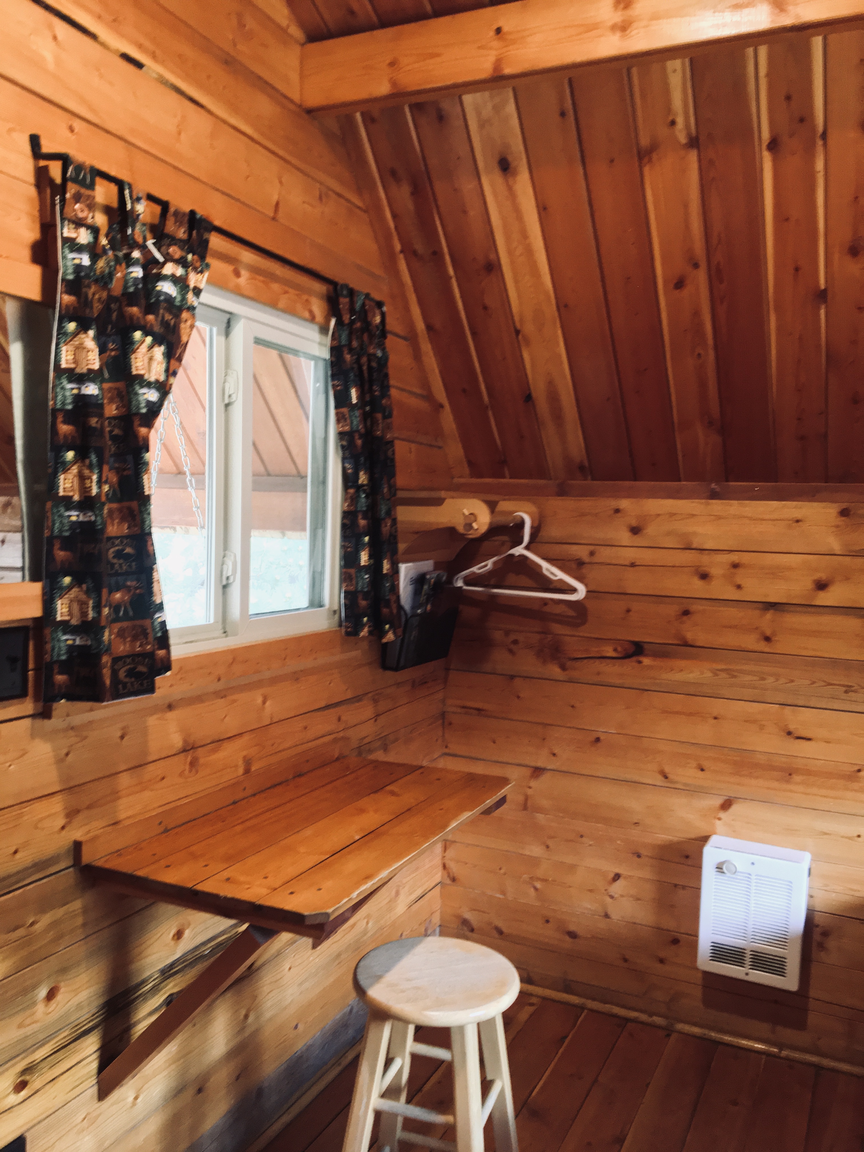 One Room Cabin Desk and coat hangers