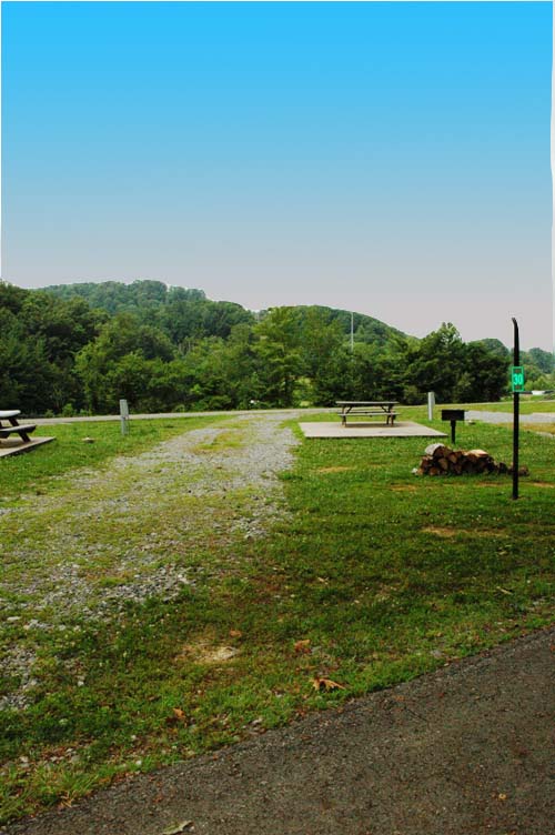 This is a pull-through site in the Ball Field section of our campground.   It is a great place for those who like to relax in a nice excluded spot.  Facing a ball field and the sun's setting point, the spots are great for those who  favor sports and great views