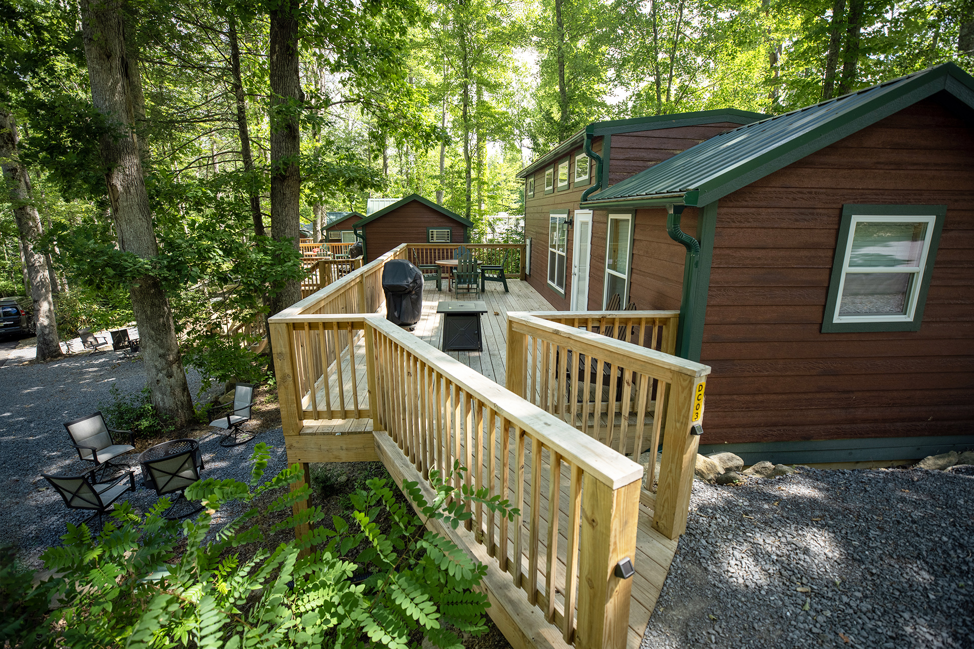 DC3 - Deluxe Cabin, 1 Room with Loft and KOA Patio® - Accessible
