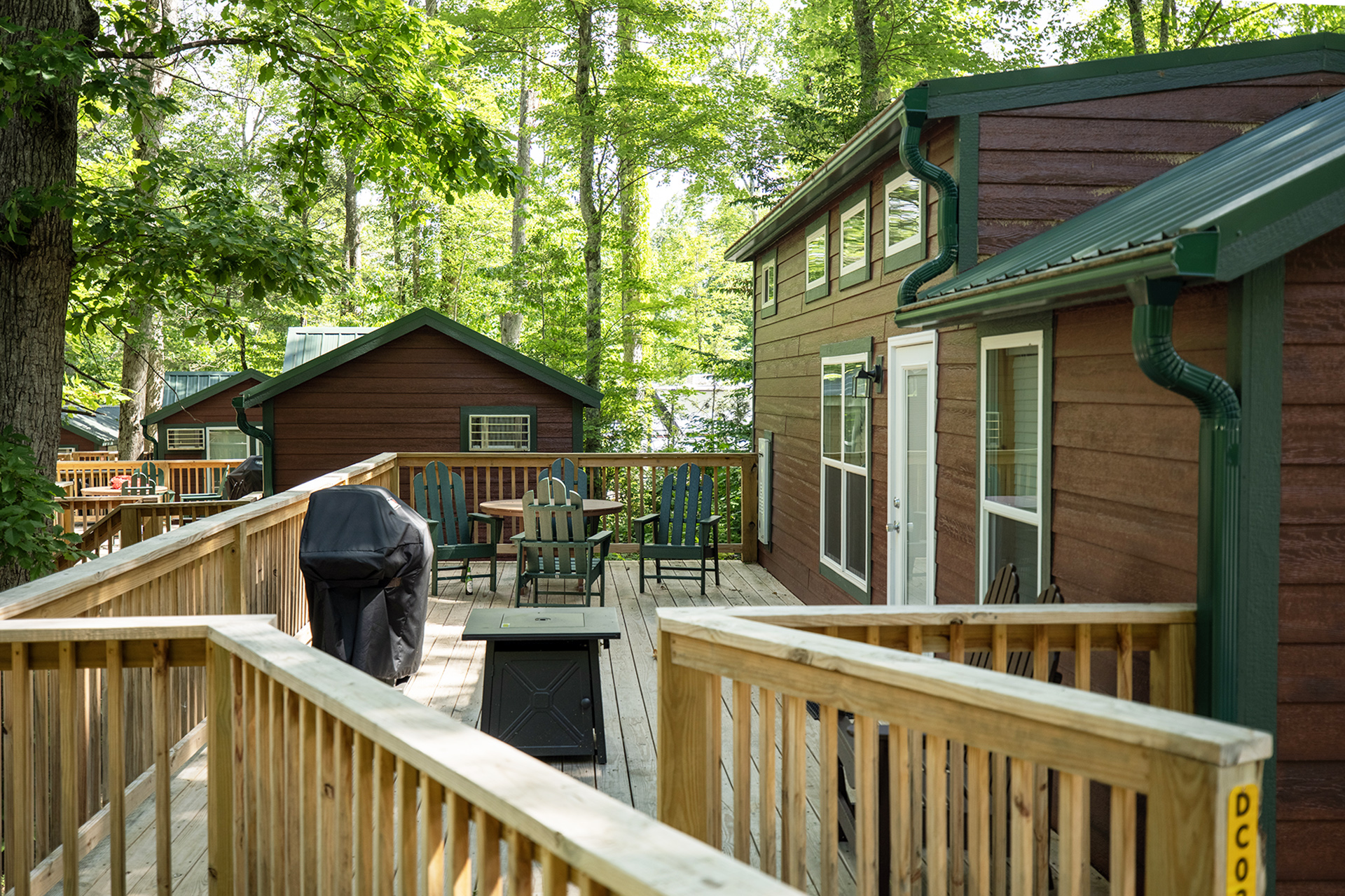 DC3 - Deluxe Cabin, 1 Room with Loft and KOA Patio® - Accessible