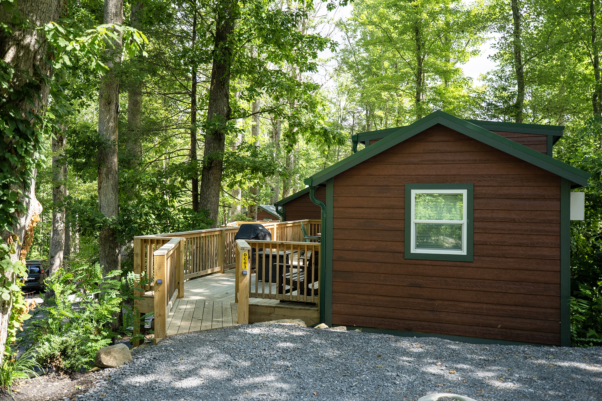 DC3 - Deluxe Cabin, 1 Room with Loft and KOA Patio® - Accessible