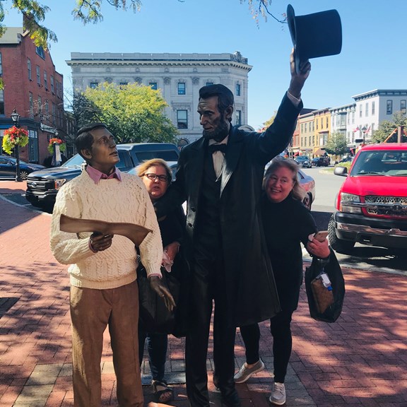 Campers posing with historical statues in Gettysburg, enjoying local attractions near Gettysburg KOA