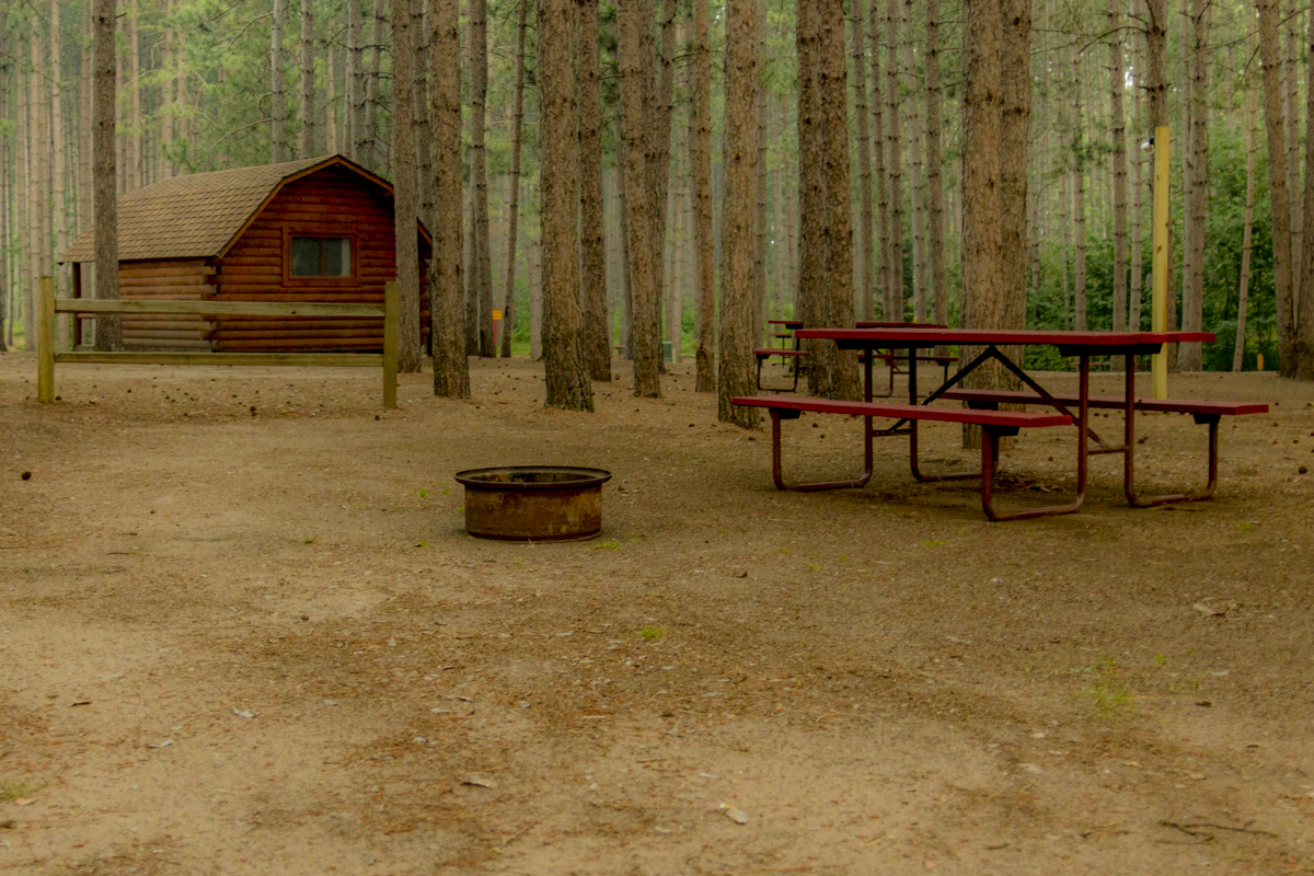 Sleeping under the stars and pines!  Our tent sites are wonderful.  Each comes with a picnic table, fire ring and most have easy access to our community camping kitchen with sinks and stove tops.  Deluxe tent sites include crushed sand pads and electric hookups.  Come find your special spot in the beautiful Northwoods.