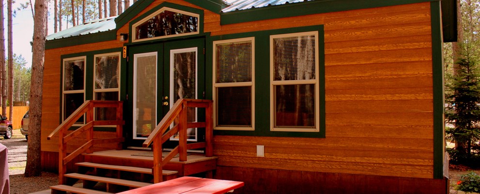 Luxury in the pines.  These deluxe cabins are family ready with kitchenettes, baths, patios, grills, fire rings and more.  They sleep 6 in a variety of floor-plans.  Your's awaits!