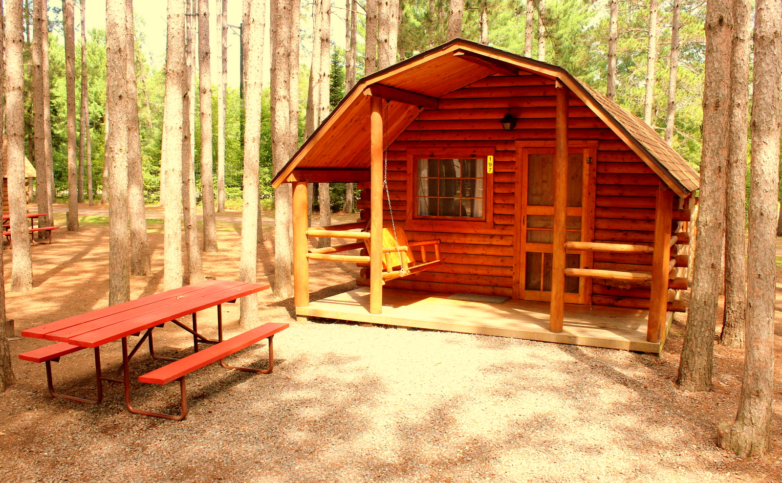 Enjoy our beautiful rustic cabins nestled in the pines.  They are either one bedroom sleeping 4 or two bedrooms sleeping 6.  All have porches, fire rings and picnic table.  Why stay in a motel?