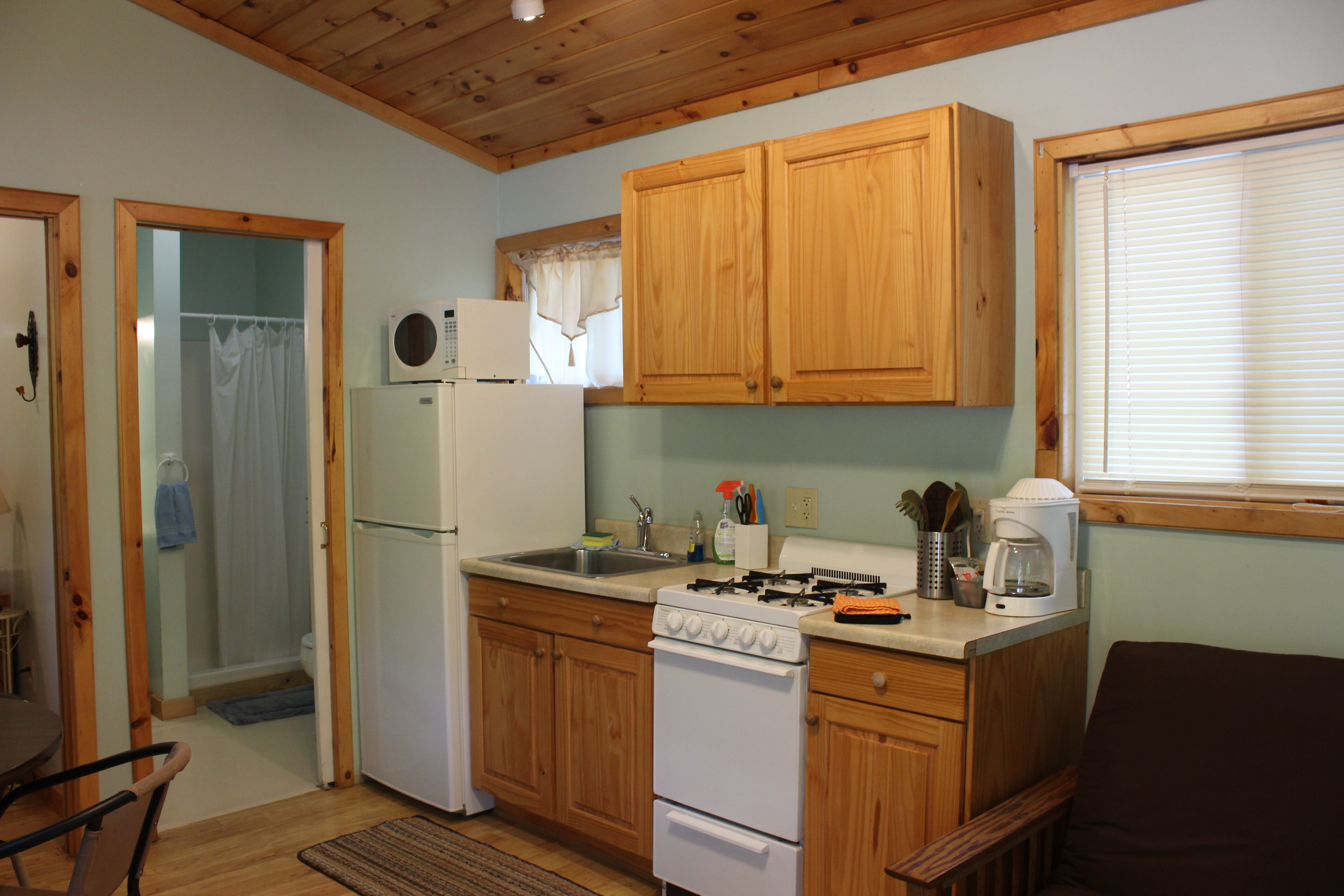 Coup Deluxe Cabin- sleeps 4, kitchen and living area.  Has a bath with shower