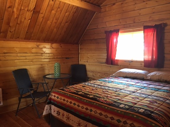 Couples Cabin queen bed & table