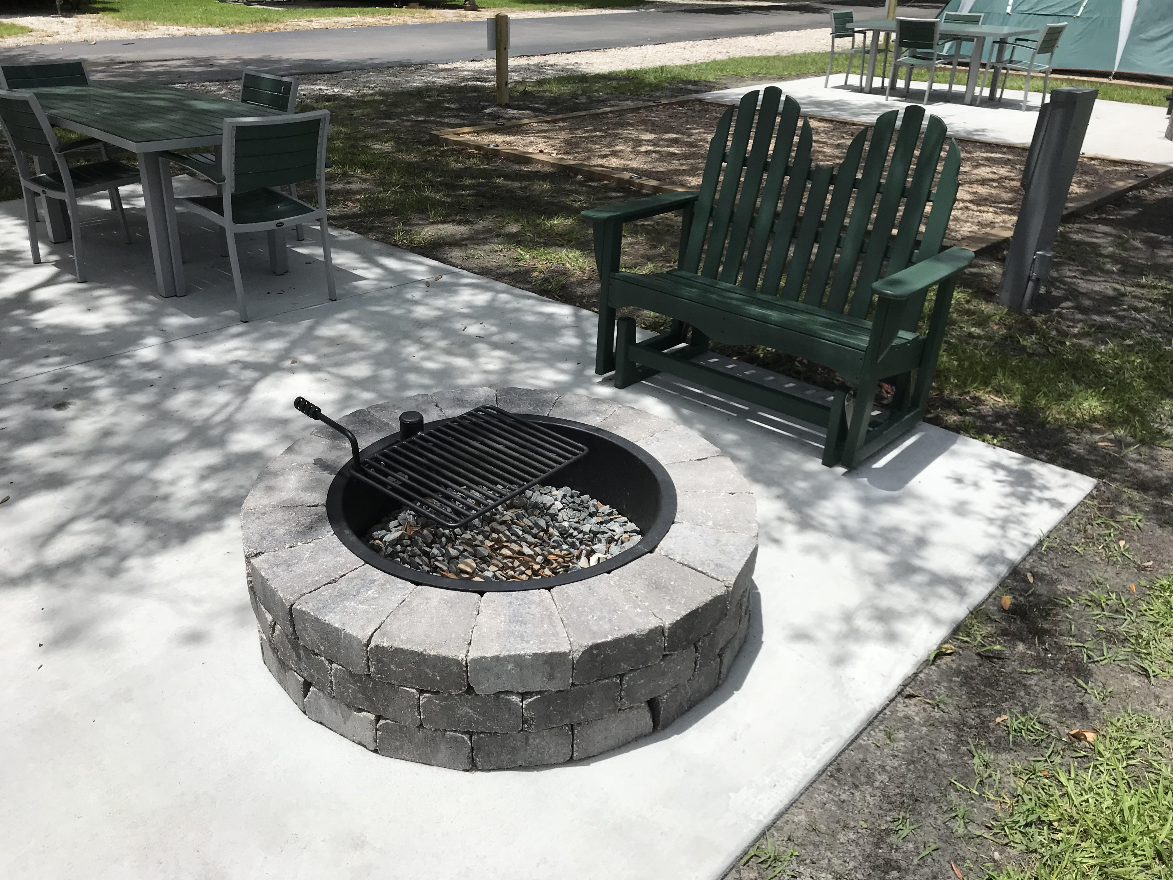 Tent Fire pit w/ cooking grate, glider and patio furniture